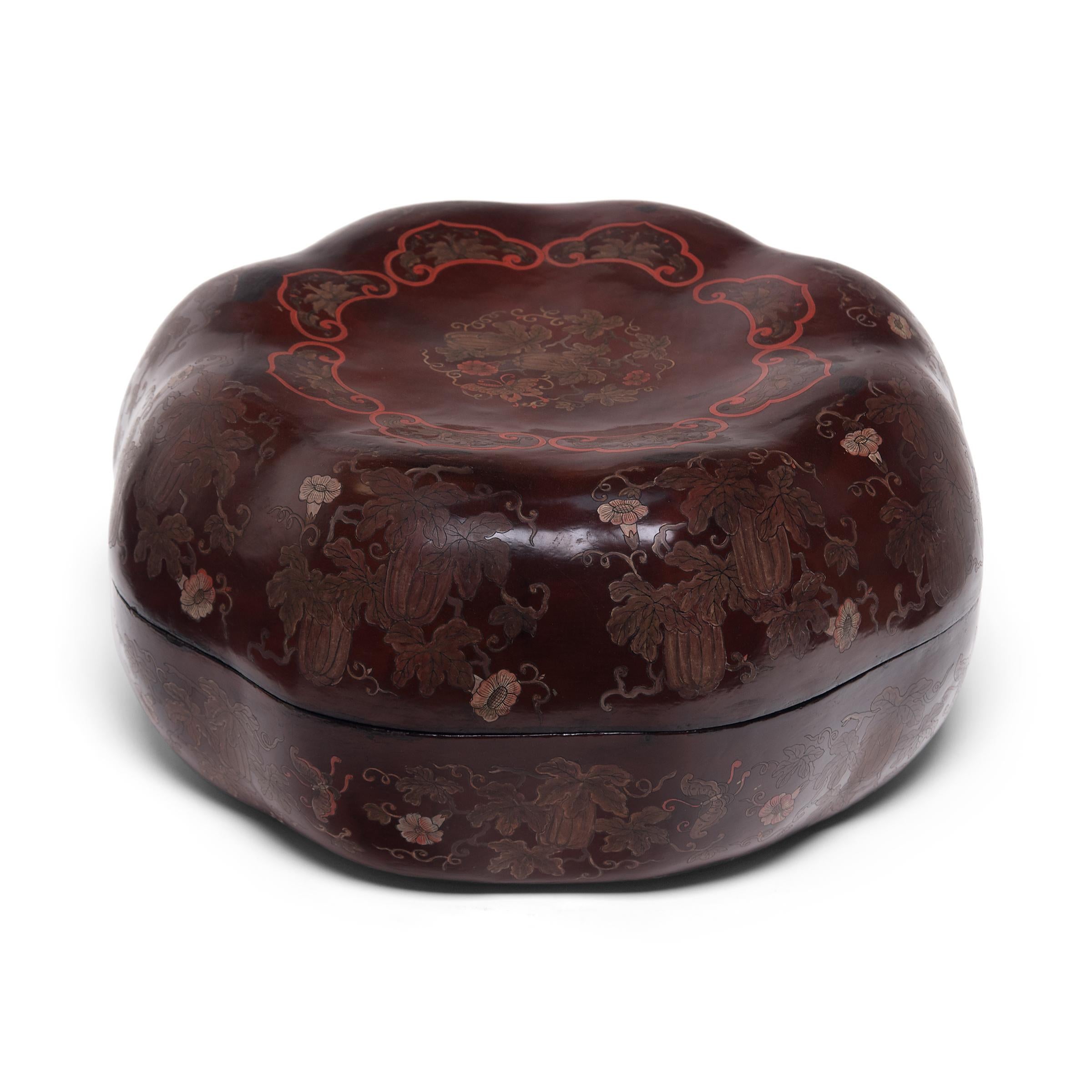 This finely lacquered box was once presented as a gift, filled with popular snacks like roasted melon seeds, dried fruit, and cinnamon-toasted soy beans. The lightweight box is formed in the shape of a melon, a traditional symbol of perpetuity.