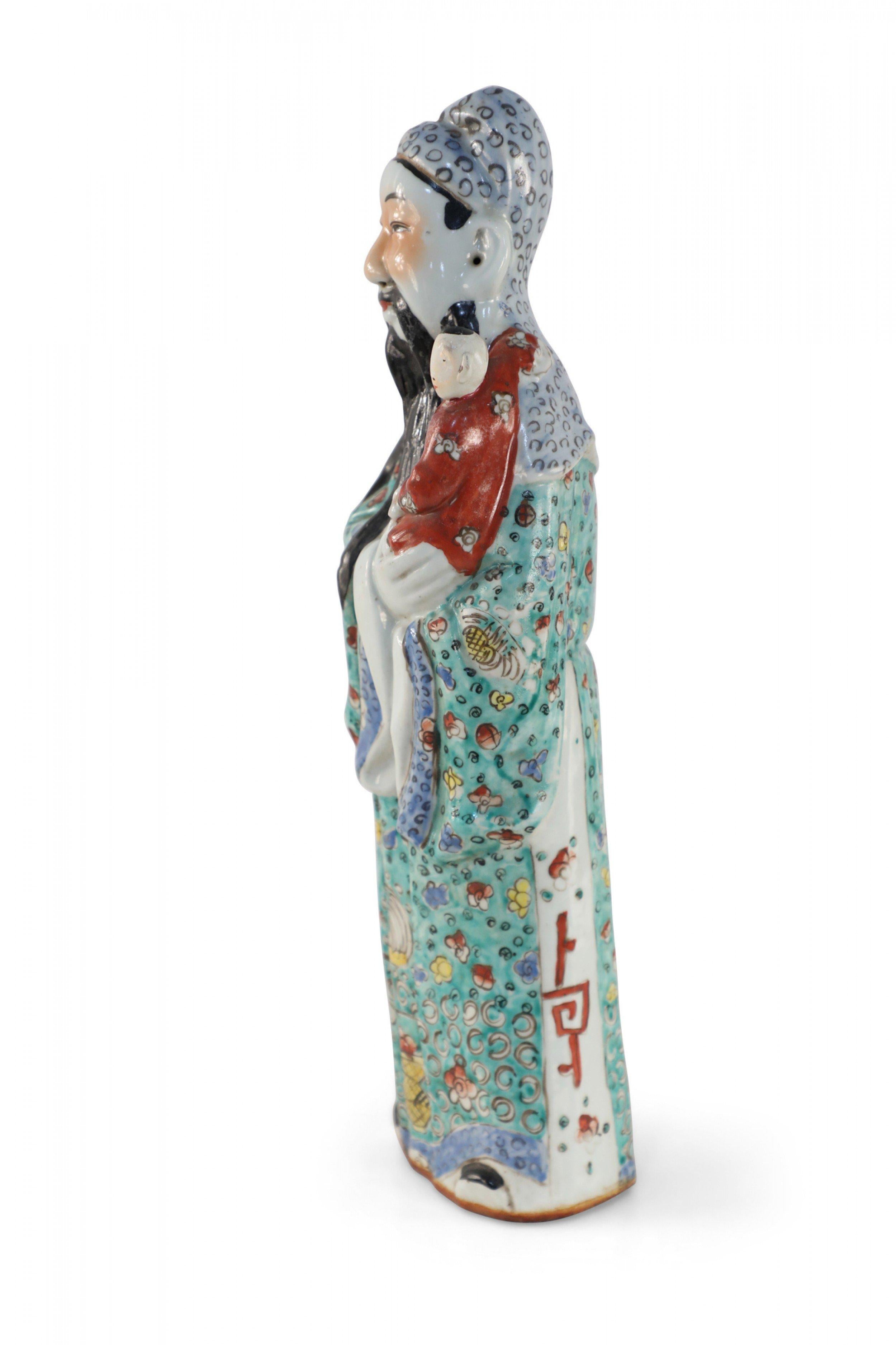 Antique Chinese (Early 20th Century) glazed porcelain statue of Lu Xing, one of the deities of the three stars considered essential in Chinese astrology, each representing an attribute of a good life. Xu Ling personifies wealth, influence and