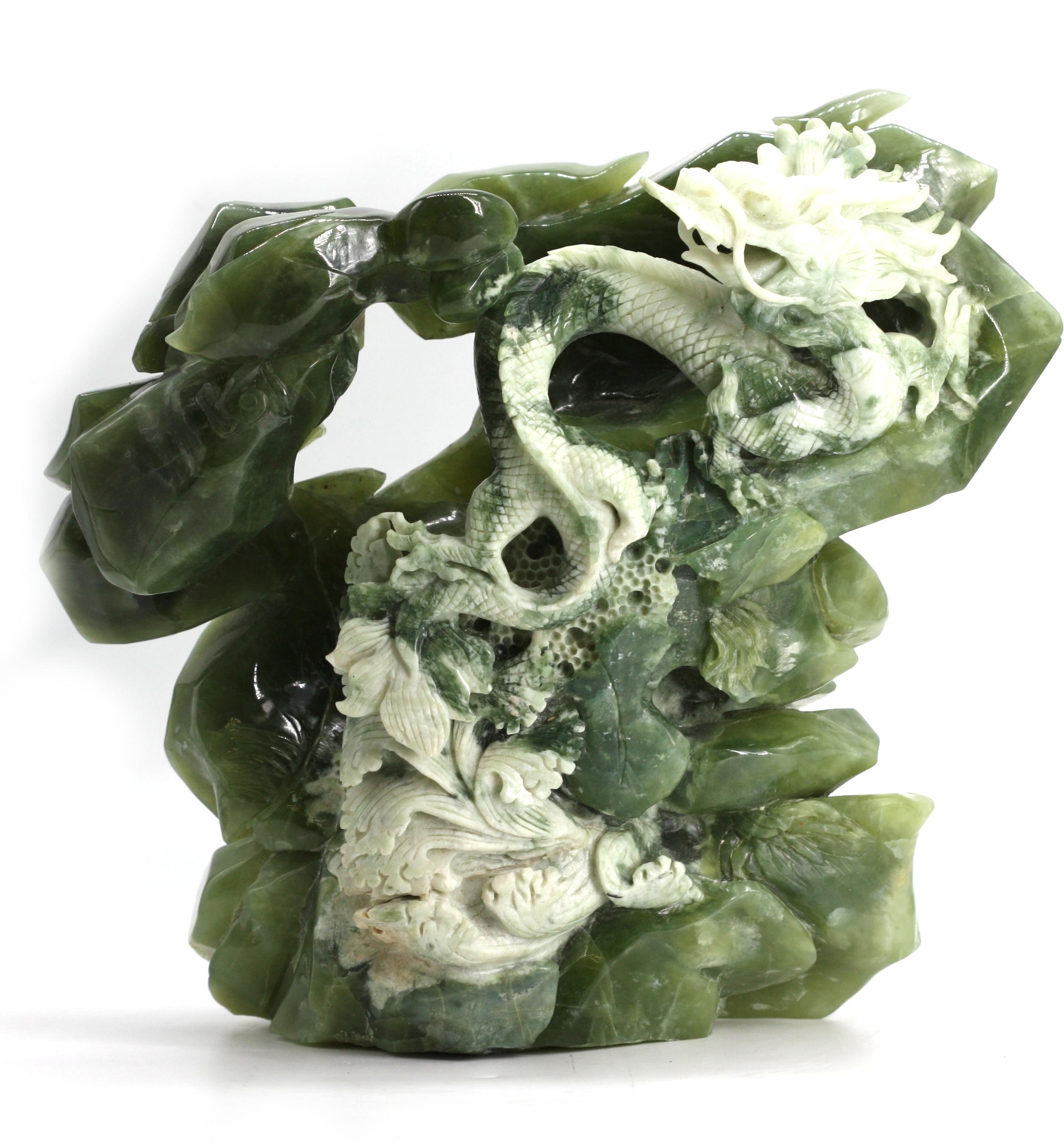 
Chinese Green and White Mineral Carving of a Dragon
Depicting a wreathing dragon amidst rocks and waves.
Height 10.5 in., Width 13 in., Depth 5.25 in.
Condition Report
Good condition.
