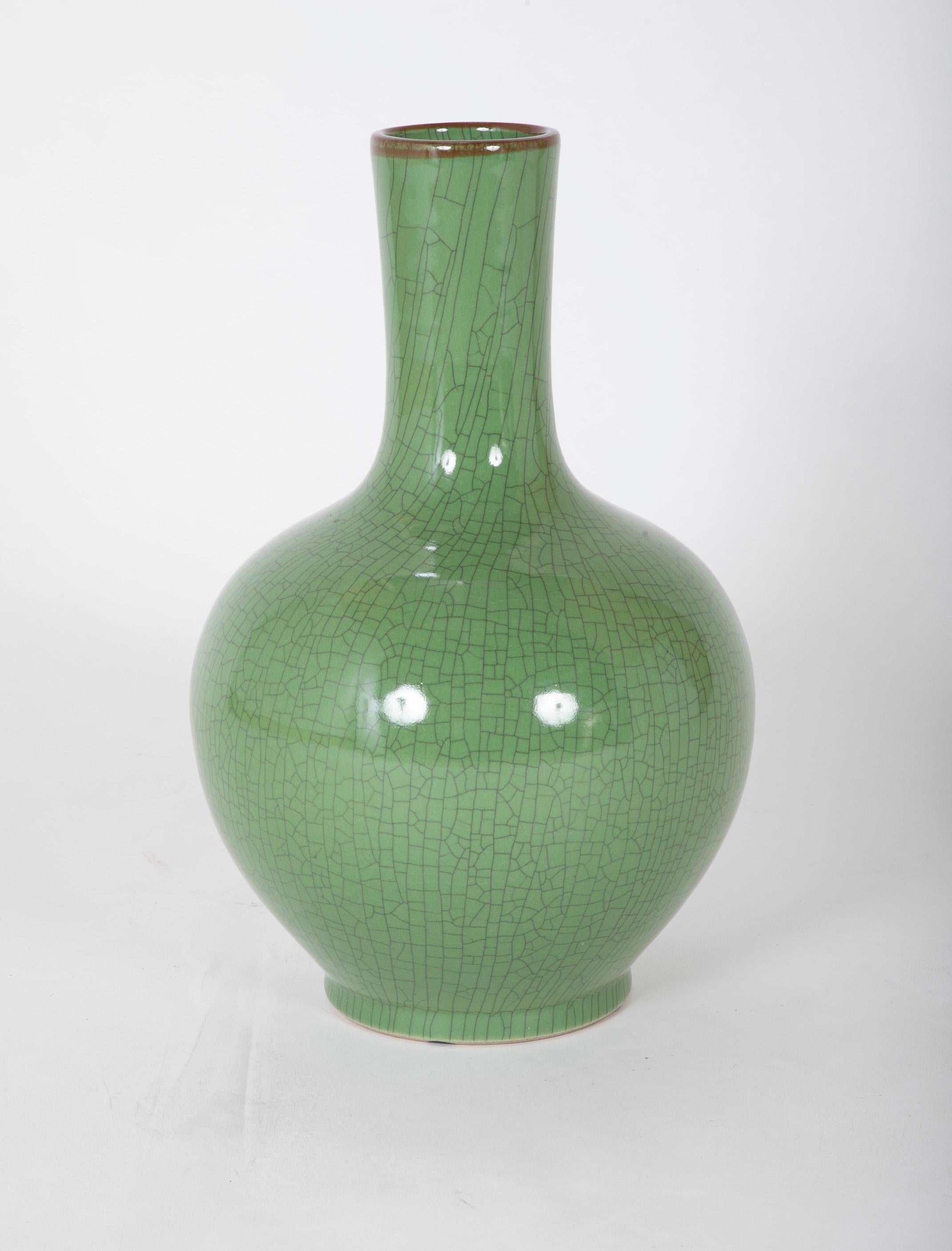 A Chinese vase of impressive size, apple green glaze with wonderful crazed surface, mid 20th century, signature on the bottom. 
19.5 inches high 12 wide and deep.