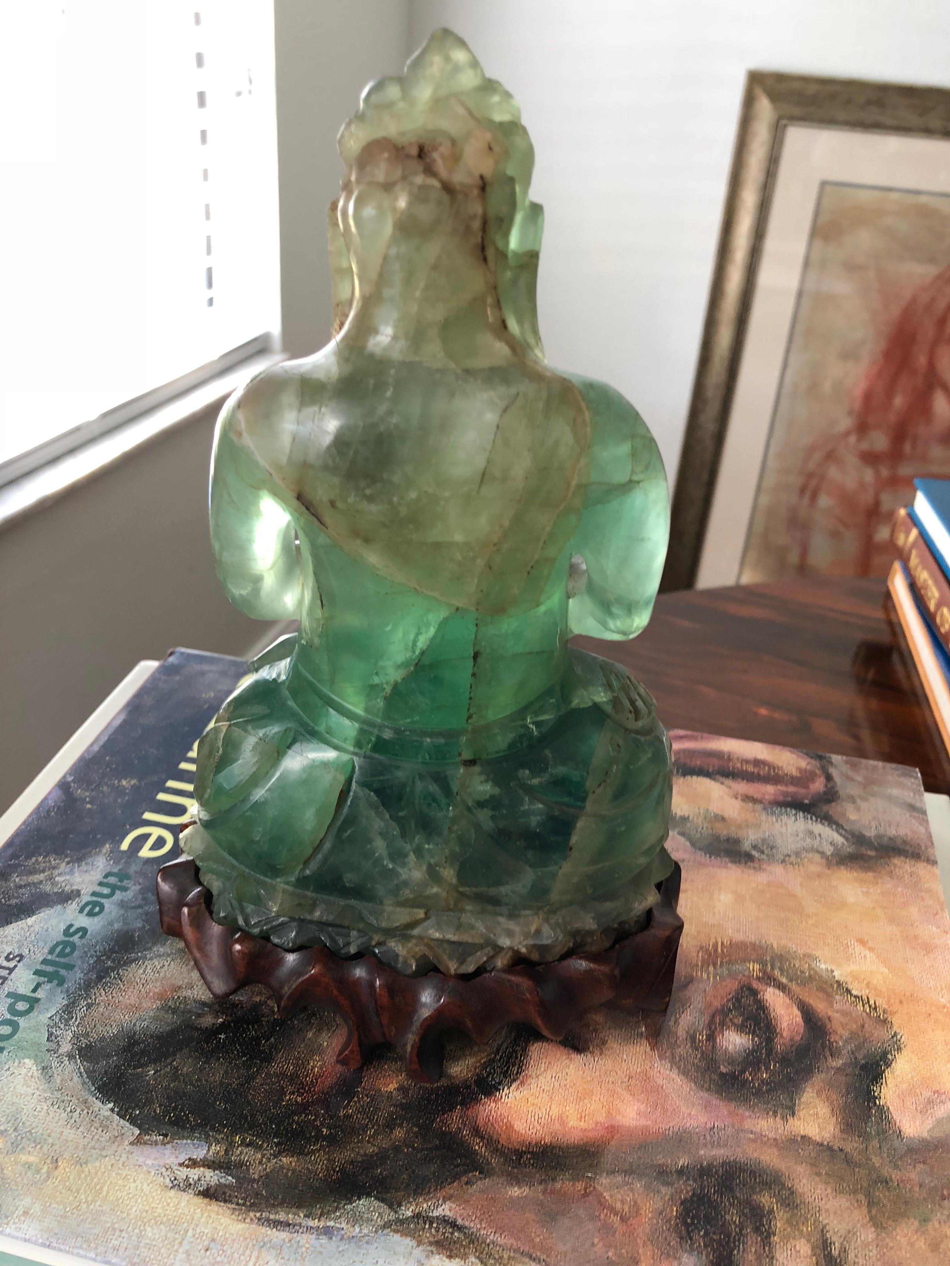 This green mineral fluorite Buddha on rosewood stand comes from a wealth family in China. Just the correct size! Wonderfully hand carved,
early 20th century.