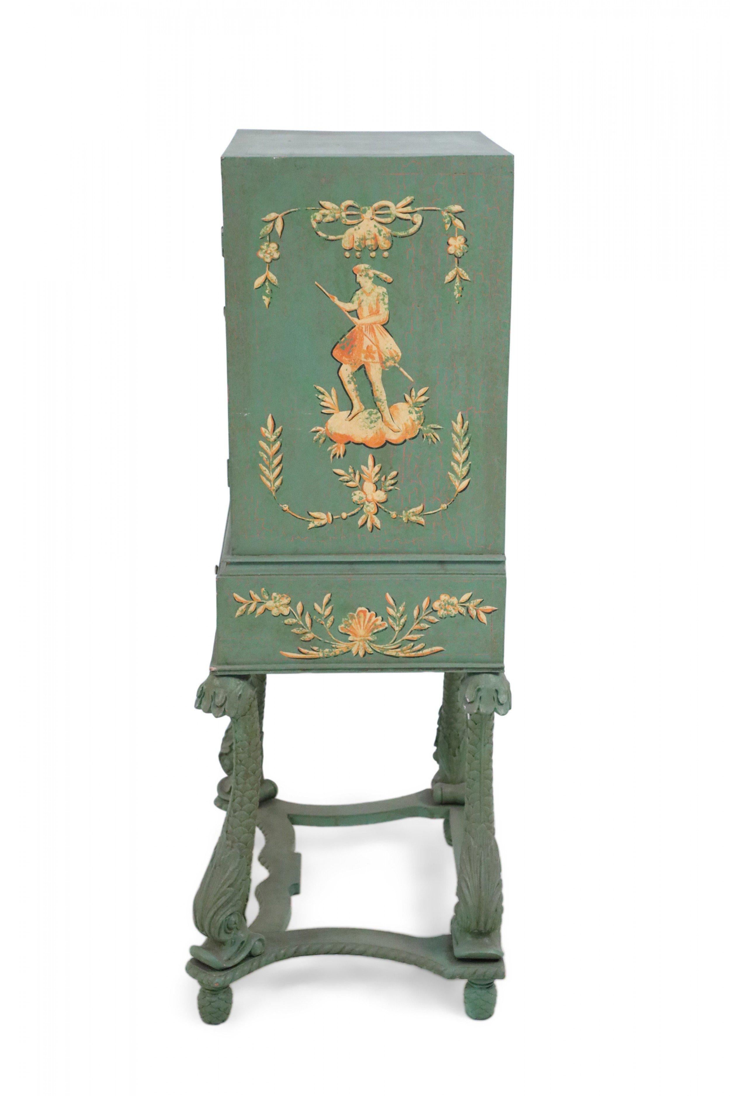 Vintage Chinese green high-boy painted with orange pastoral scenes on the sides and front cabinet doors, above a fish-scaled drawer with a scrolled apron featuring shells and florals, supported on carved fish-scale and head legs connected by a