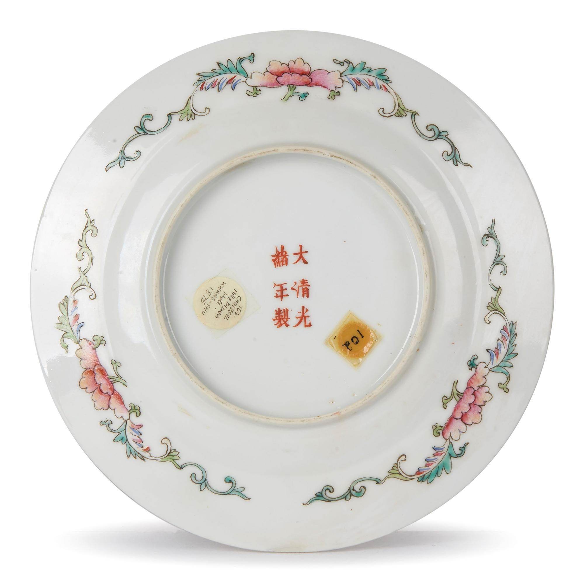 An exceptional antique Chinese Guangxu reign porcelain plate decorated in millefleur pattern in bright vibrant polychrome enamels on a black ground with gilded highlights. The small rounded plate has a gilded rim with further polychrome decoration