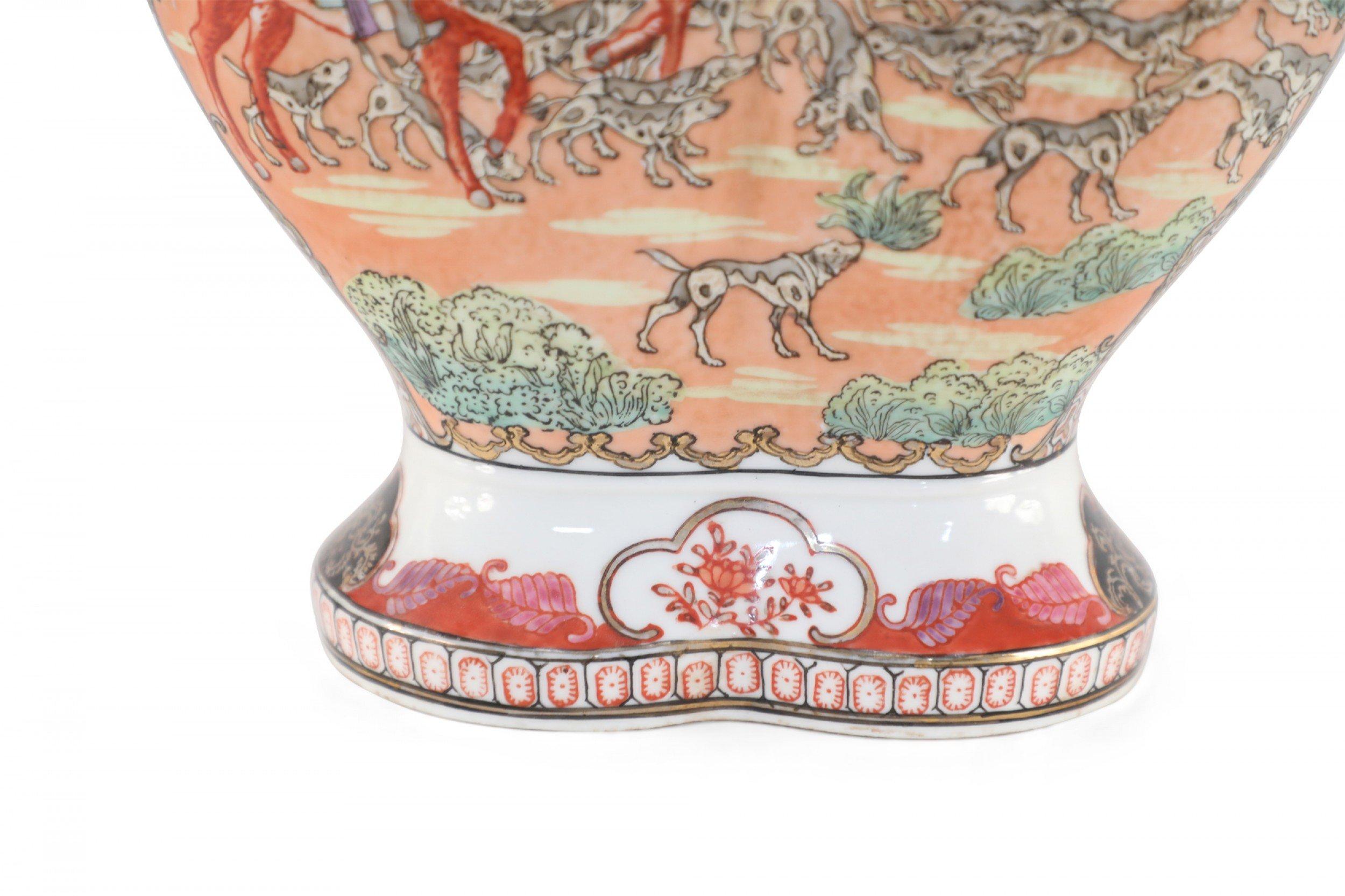 Antique Chinese (Early 20th Century) Guangzhou painted export porcelain vase with a conjoined form depicting a richly colored dog hunt scene between gold-patterned bands.
 