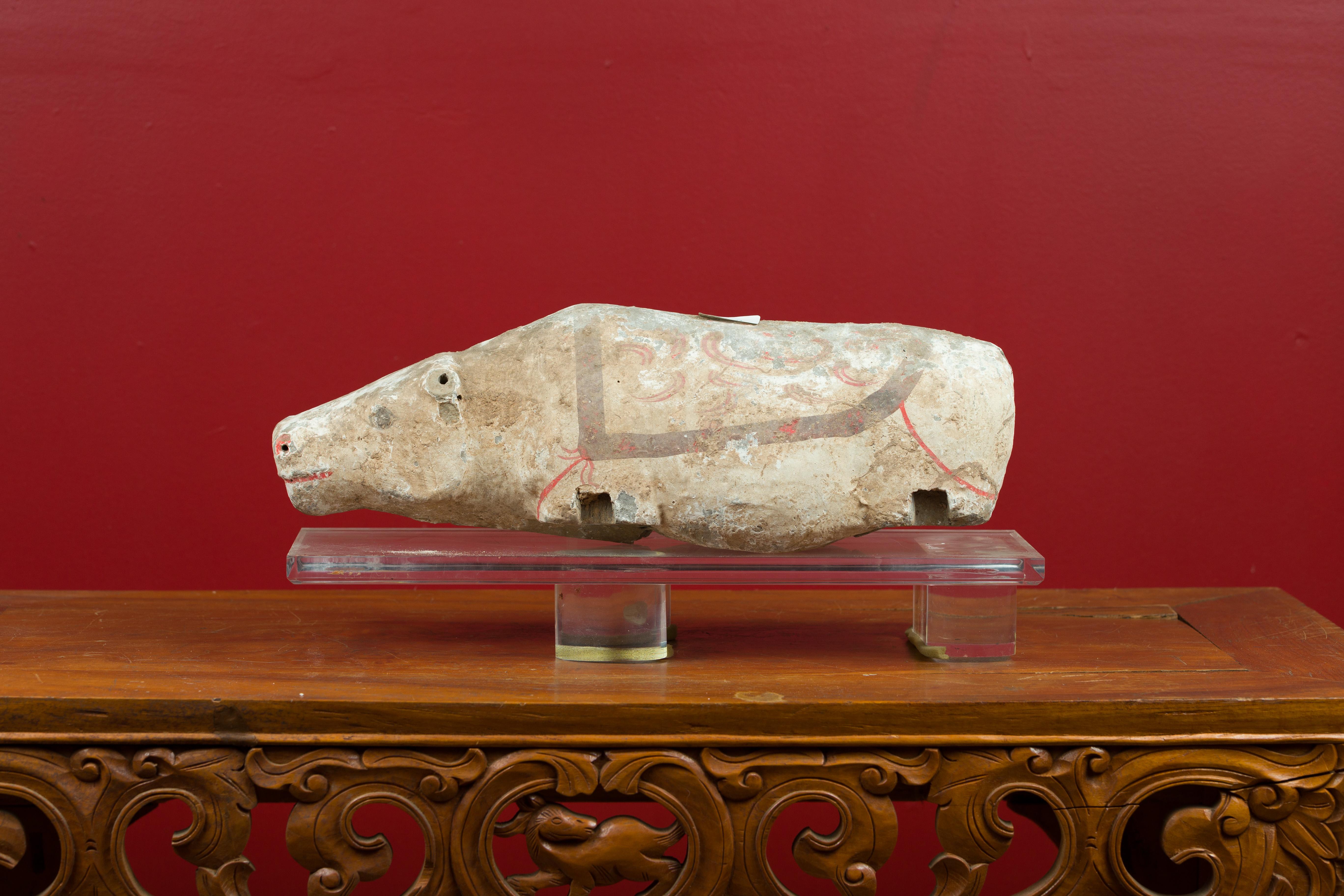 A Chinese Han dynasty hand painted hippopotamus circa 202 BC-200 AD on custom made Lucite base. Crafted in China during the prestigious Han dynasty, this small terracotta hippopotamus figurine showcases its original hand painted decor. A symbol of