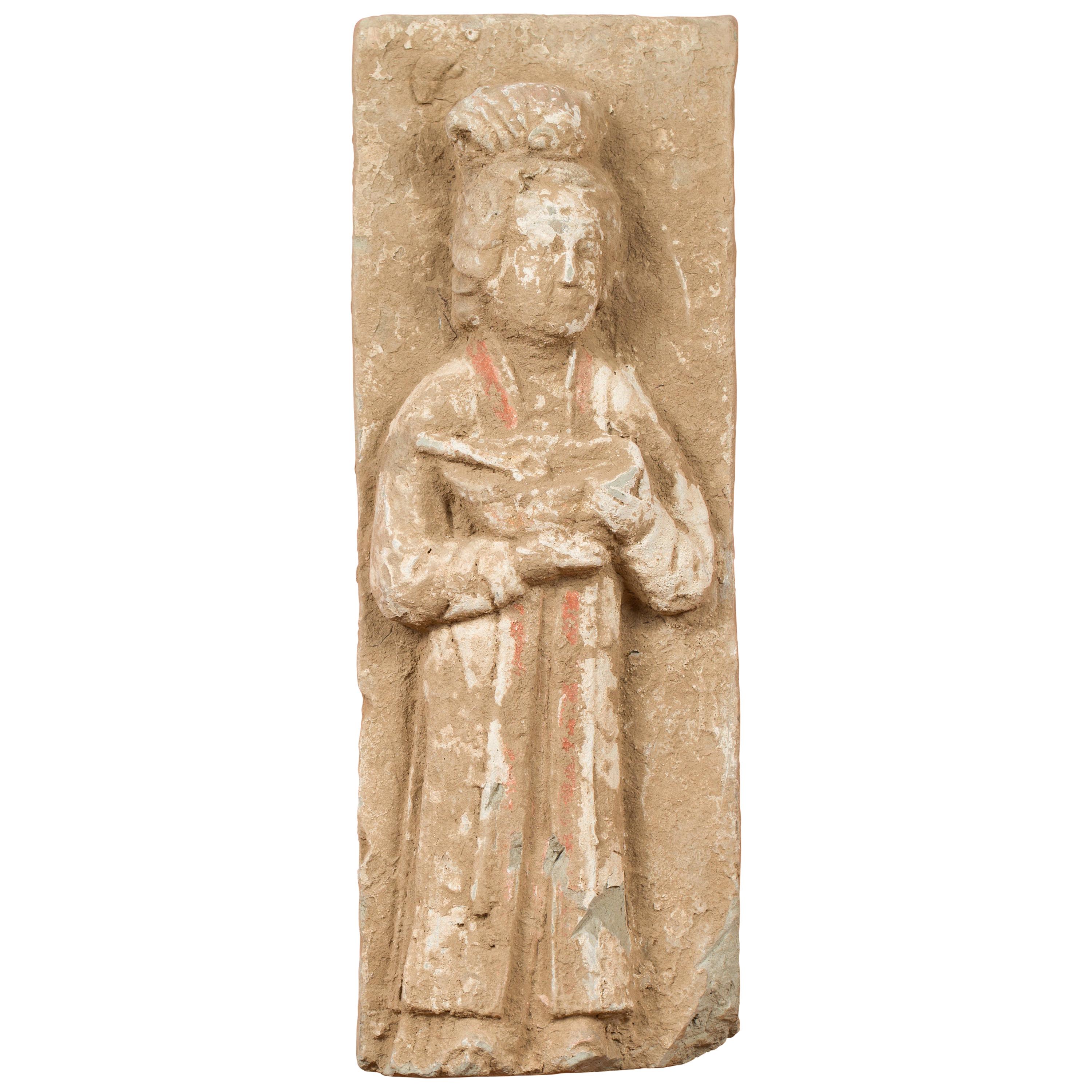 Chinese Han Dynasty Period Wall Plaque Depicting a Woman Carrying a Dish