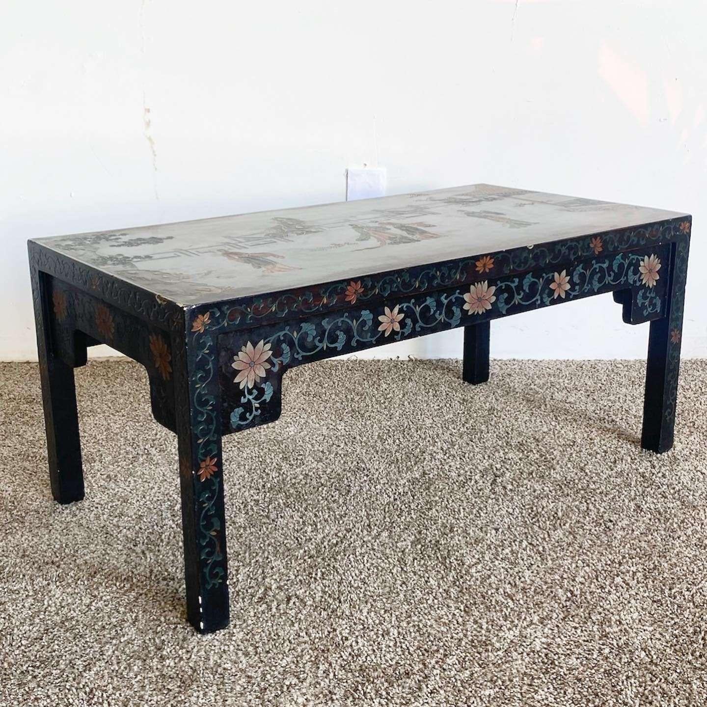 Exceptional vintage chinoiserie black lacquered rectangular coffee table. Features a hand carved and painted design throughout the table.
