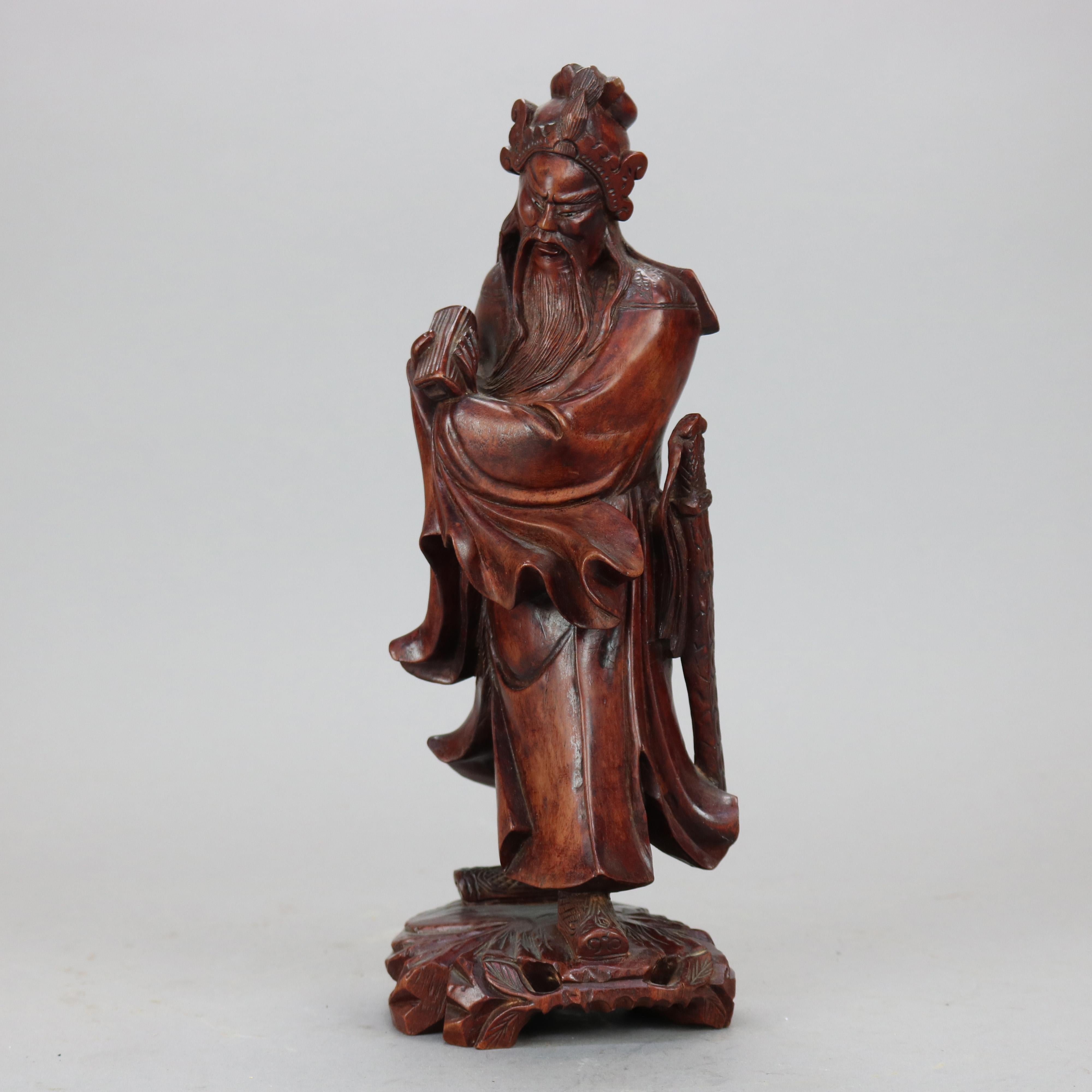 A Chinese hand carved carved hardwood figure depicts a wise man in countryside setting, 20th century

Measures - 12'' H x 4.75'' W x 4'' D.
