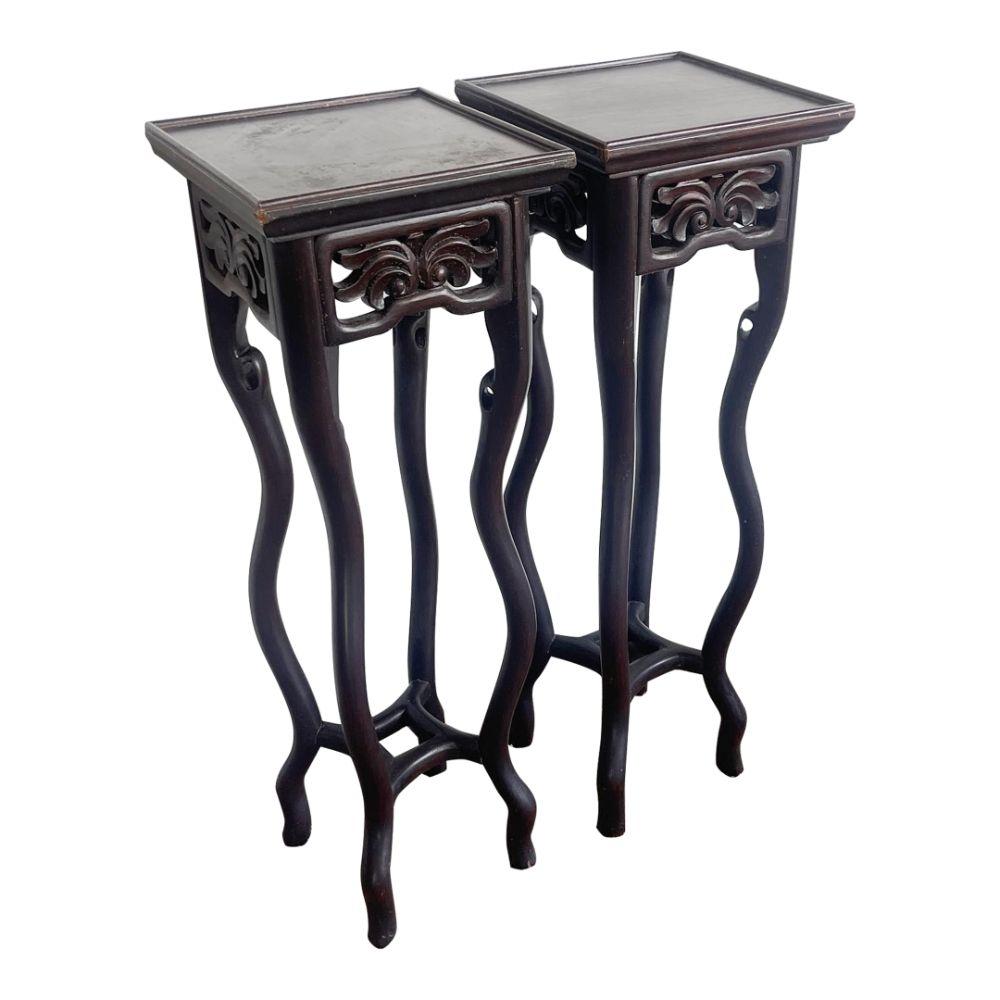 Enhance your space with Chinese Rosewood Pedestal Tables, a pair featuring intricate hand-carved designs and rich rosewood craftsmanship.

Remarkable pair of tables reflecting traditional Chinese artistry.
Chinese Rosewood Pedestal Tables made from