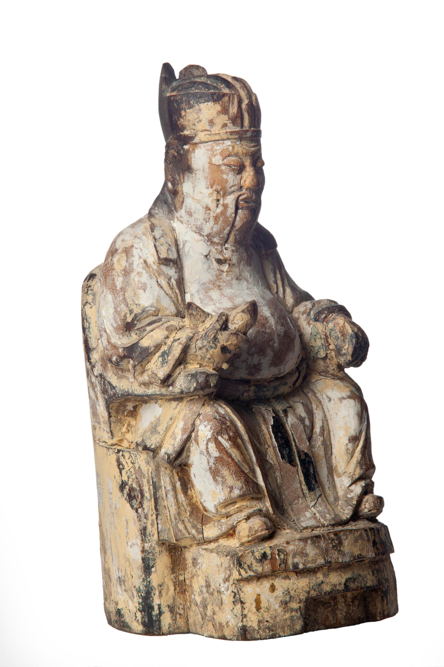 This one-of-a-kind hand-carved antique wood buddha is certified to be over 180 years old and sits 9