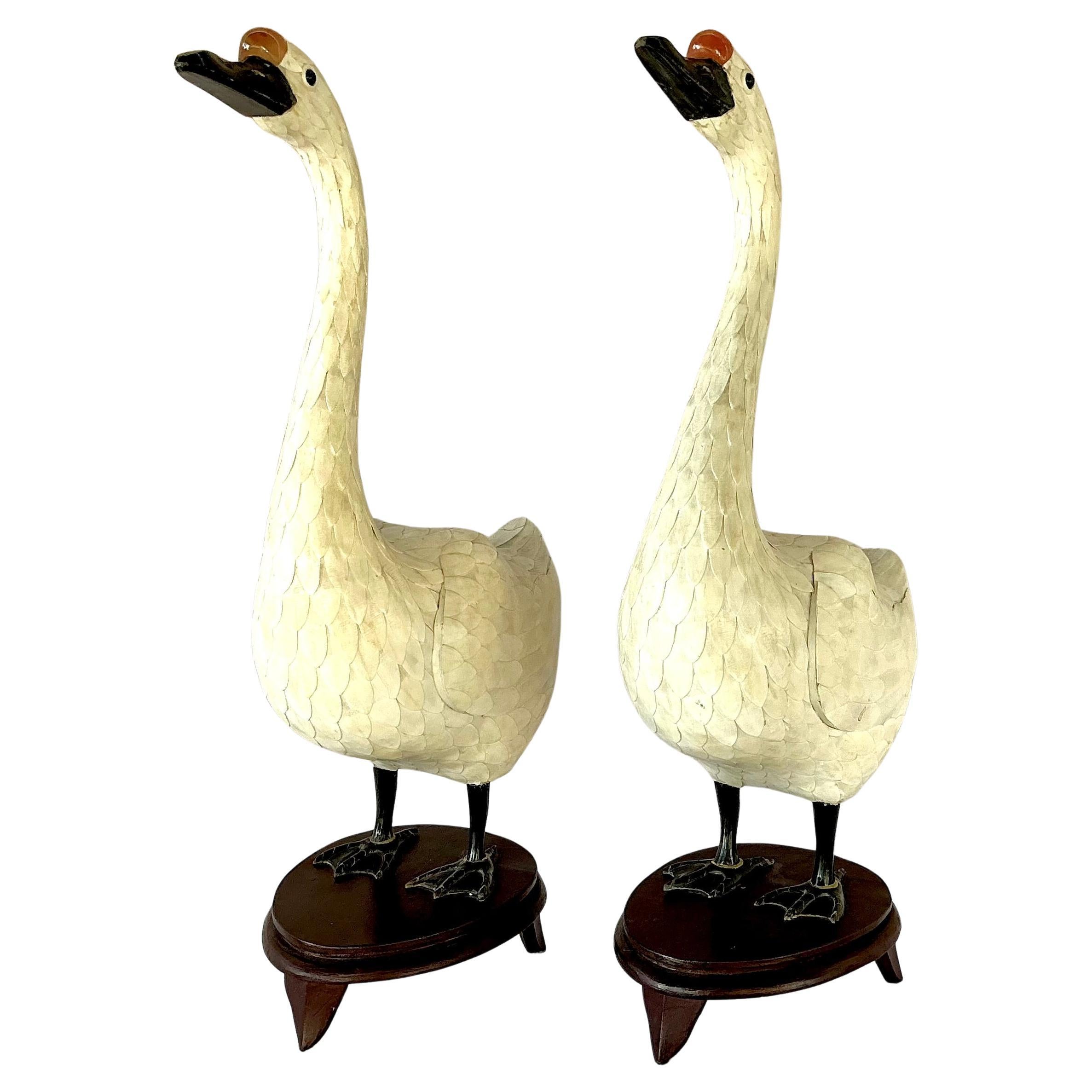 A Pair of Chinese Tessellated Bone Veneered Geese Sculptures with hand-cut bone veneer arranged in overlapping feather-like scales. Each goose features a gracefully elongated neck and a serene expression, naturalistic wing contouring, and finely