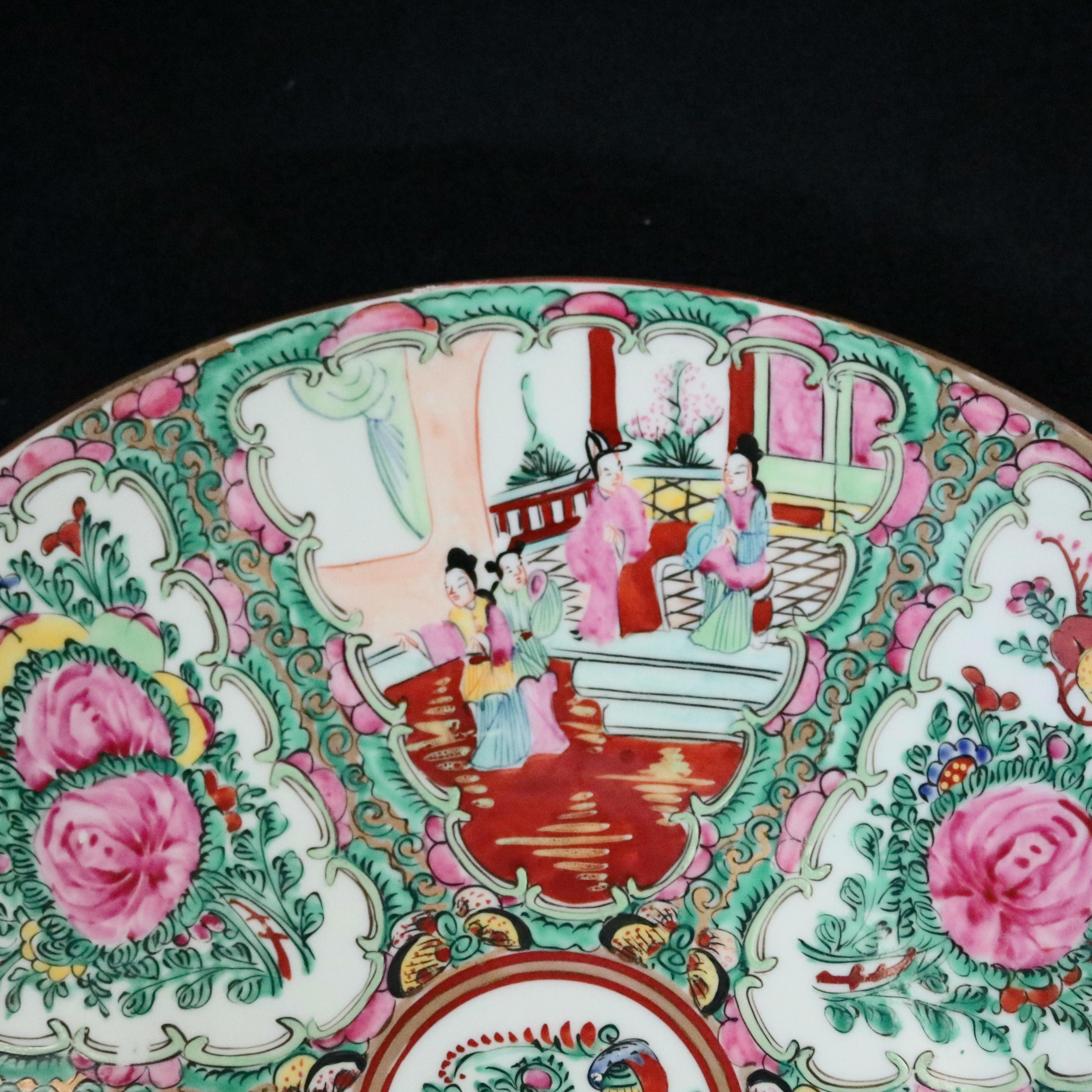 A Chinese Rose Medallion charger offers porcelain construction with hand painted enamel panels of alternating genre and garden scenes, stamped en verso as photographed, 20th century

***DELIVERY NOTICE – Due to COVID-19 we are employing NO-CONTACT