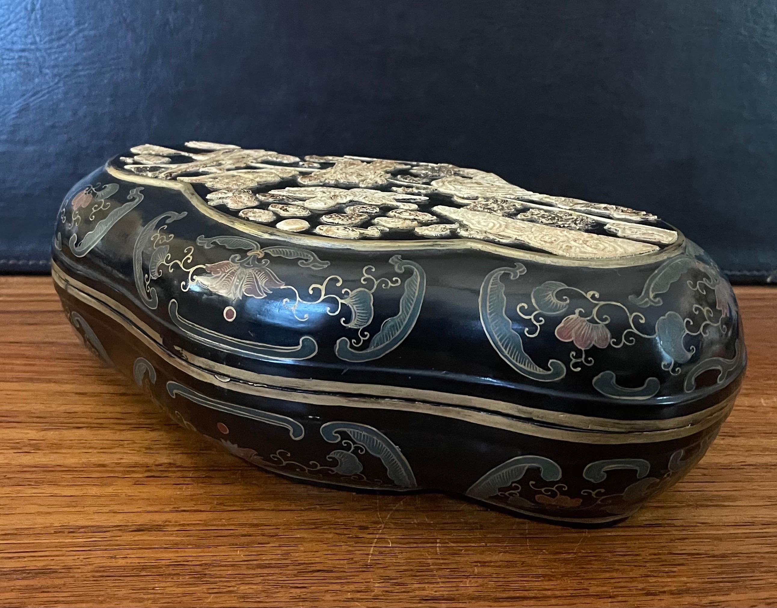 A wonderful hand-painted Chinese lidded black lacquer box, circa 1940s. The handcrafted box measures 13.5