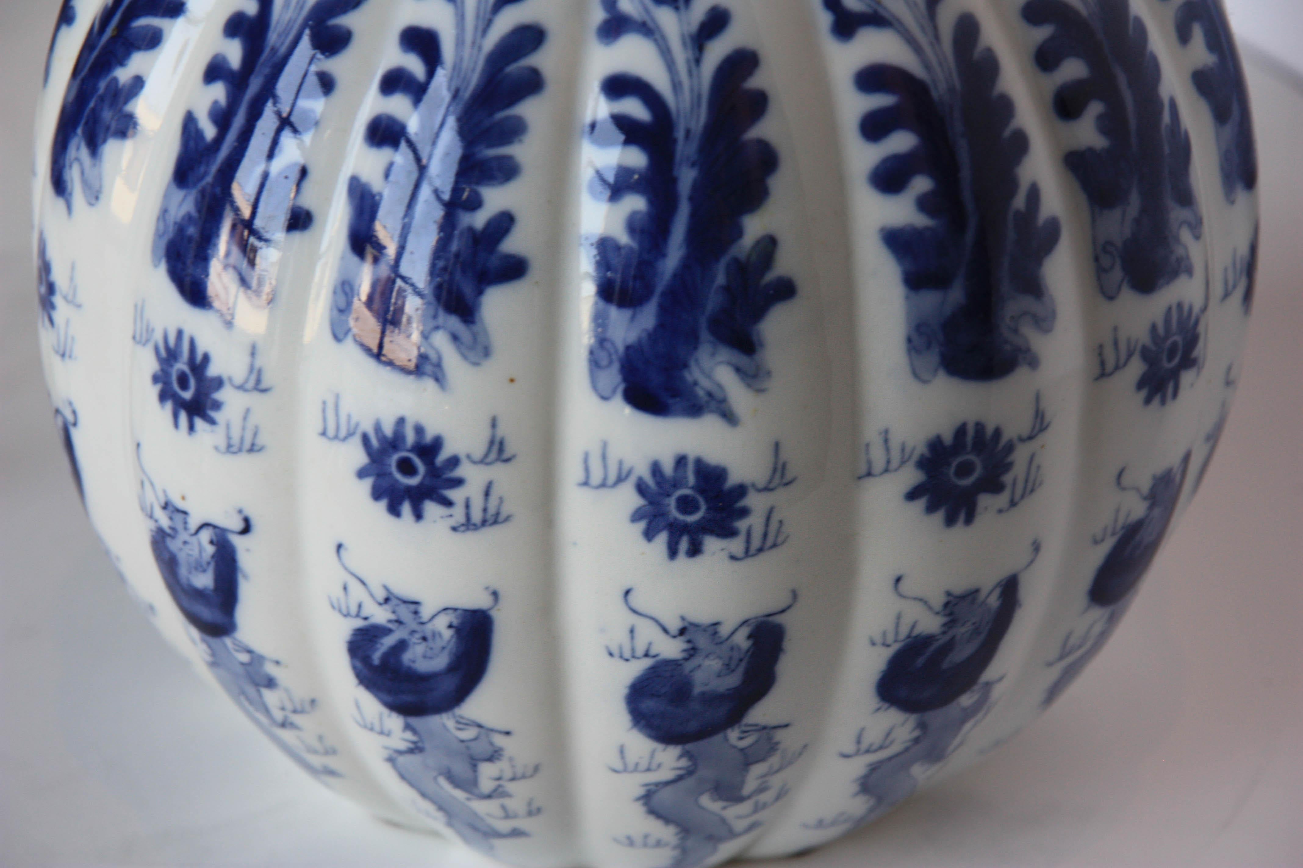 Chinese hand painted blue and white lidded gourd vessel.