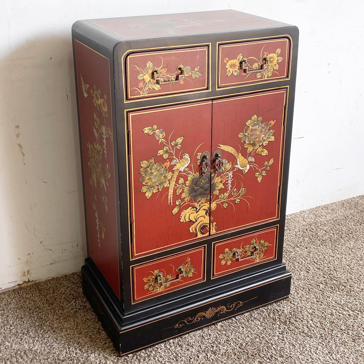 Immerse in the beauty of traditional Chinese artistry with this Red and Black Waterfall Cabinet. Hand-painted with precision, it features birds amidst flora, set against a striking red and black backdrop. The waterfall design, characterized by the