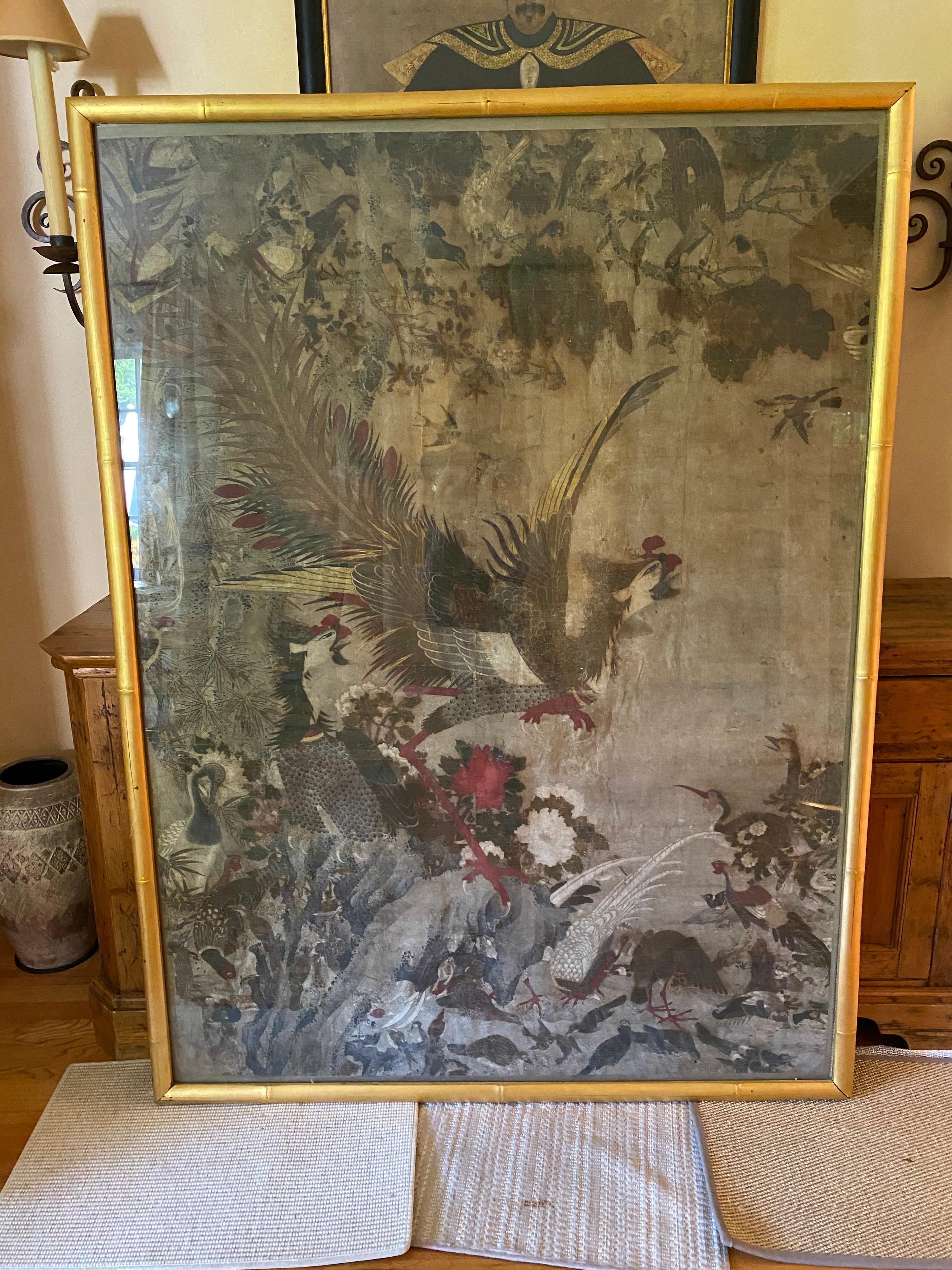Chinese hand-painted wallpaper of Phoenix, 18th century wallpaper stretched on wood. Some crazing and fine cracks evident upon closer look. Behind glass. The painting shows incredibly fine details, especially on the feathers.

During the 17th