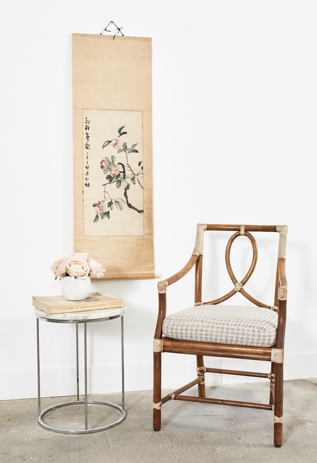 Seasonal autumn Chinese hanging scroll painting depicting colorful Camellias with a calligraphy signature and date. Crafted on hand-made mulberry paper with a silk hanger and a wooden digan round bar on the bottom having decorative faux-ivory ends.
