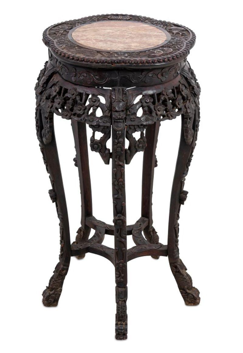 Chinese Carved Hardwood and Marble Pedestal Table, late 19th century, the lobed inset top above a carved frieze, on scrolled legs joined by stretchers. 32.5