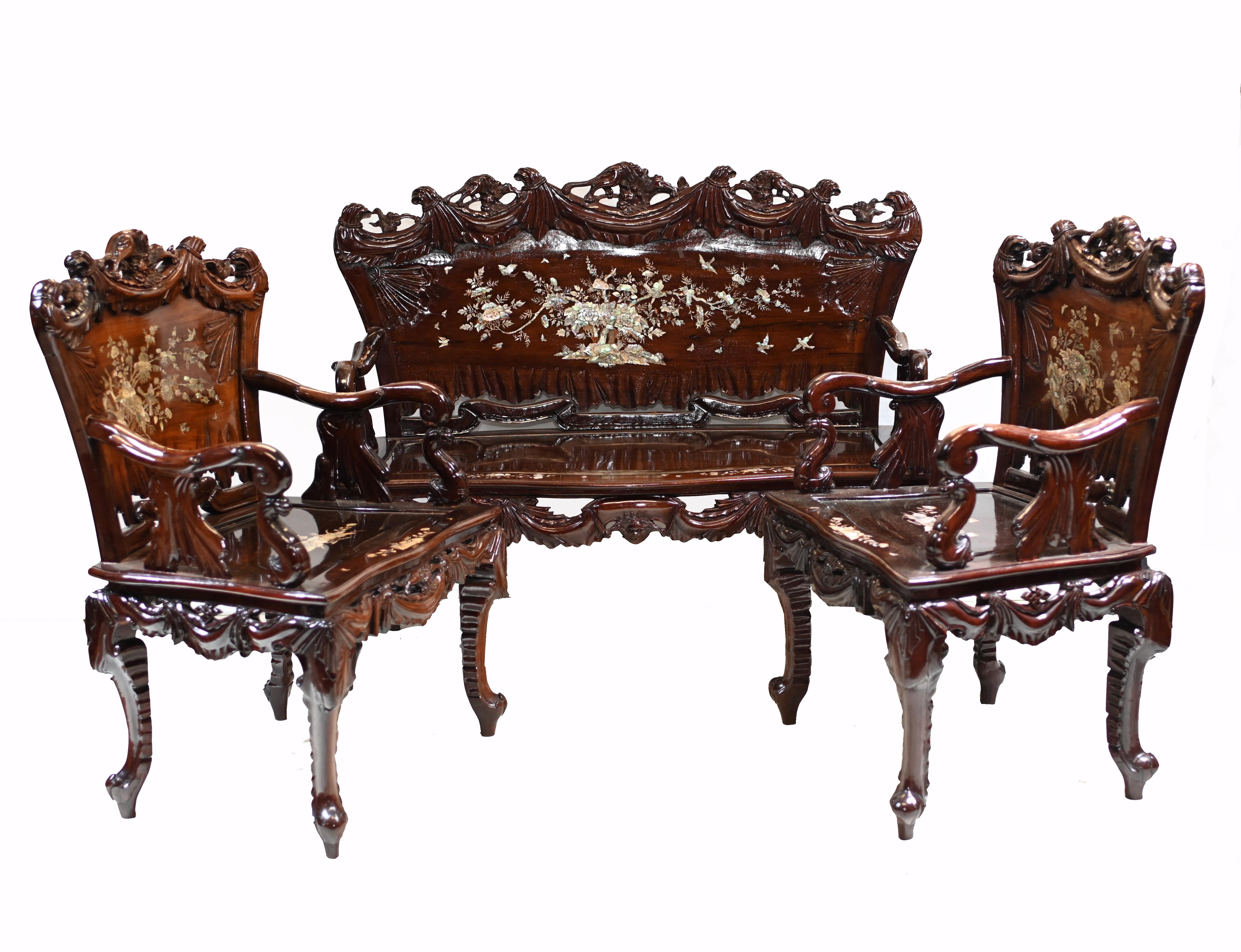 Gorgeous Chinese antique settee and two matching arm chair sets.
Profussely decorated with mother of pearl inlay work.
Includes details such as trees, birds, butterflies and other Chinese motifs
Great interiors piece and we date this set to circa