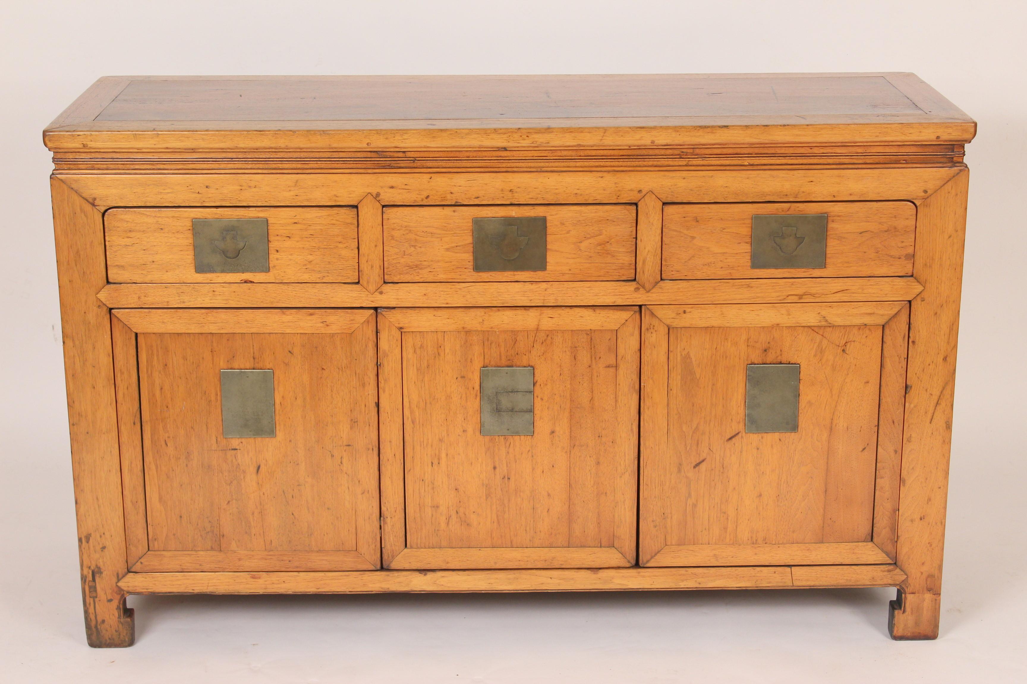 Mid-20th century Chinese hardwood buffet with brass hardware.