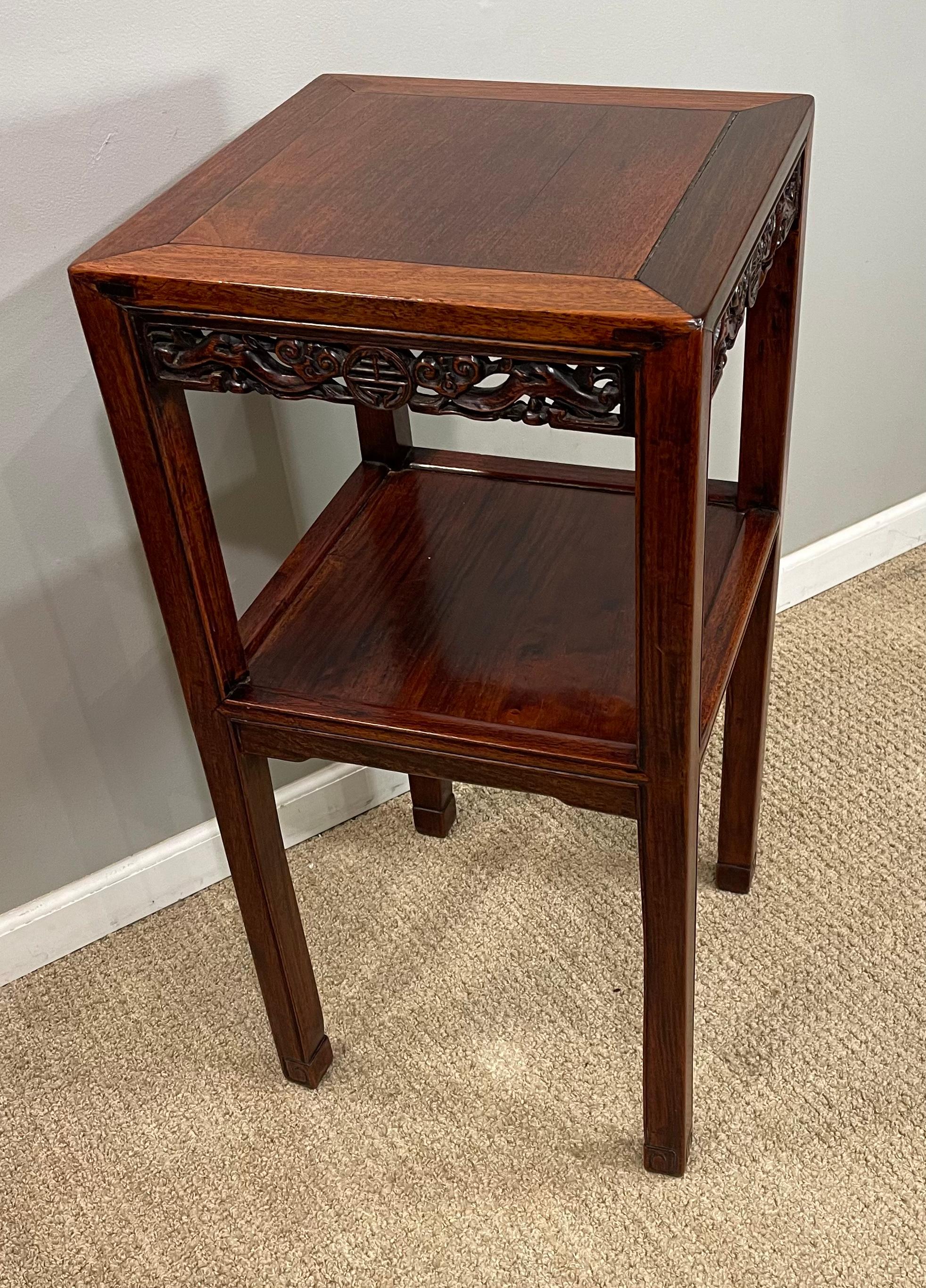 Chinese hardwood (Hungmu) tea table, late 19th century / early 20th century
Top above carved panels with lower shelf.