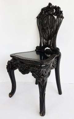 Chinese Heavily Carved Ebonized Chair with Art Nouveau Influence, Greek Key Trim