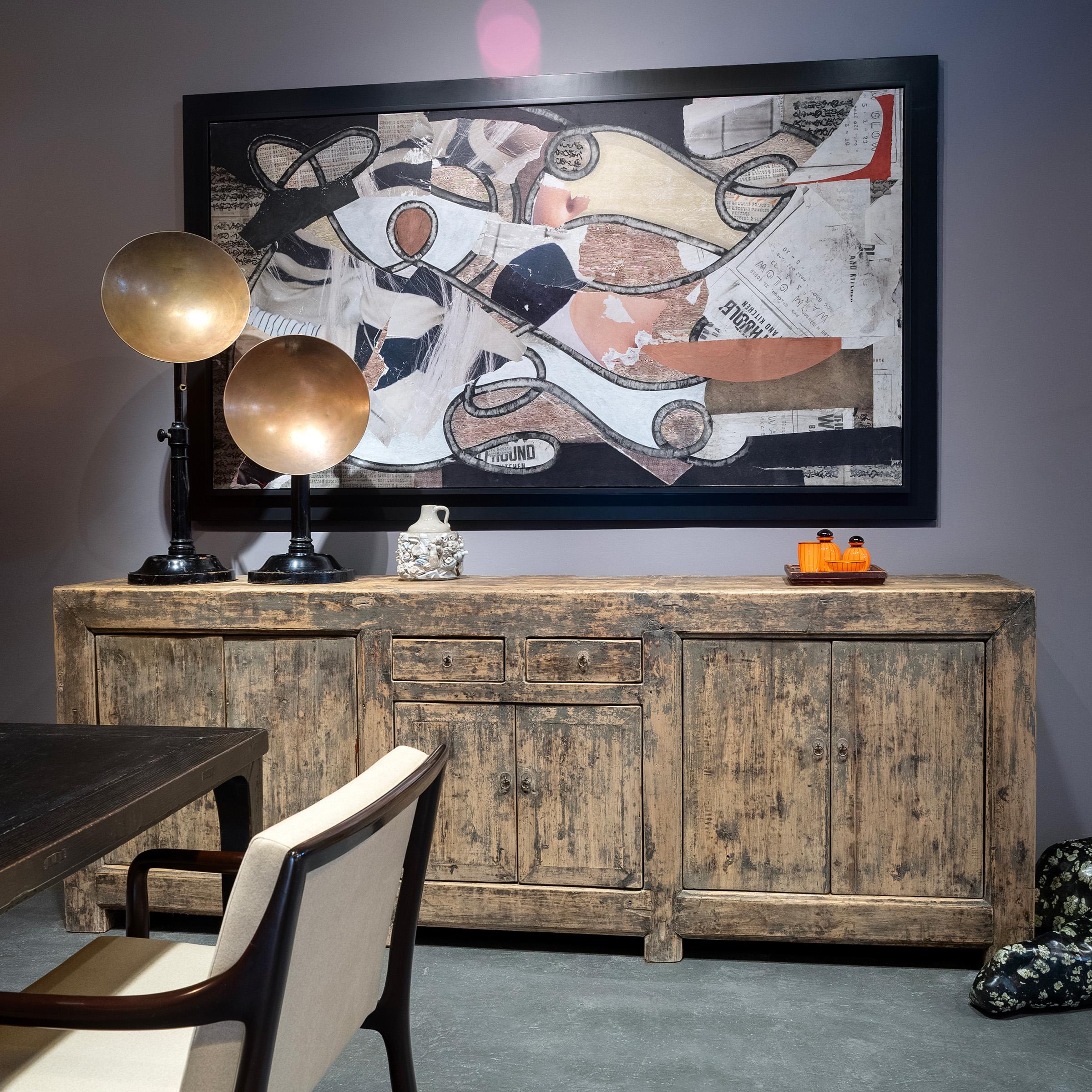 Created in the style of Mongolian storage coffers, this early 20th-century six door coffer has a minimalist design and plenty of rustic appeal. Originally configured to open from the top, the cabinet has been modified with front-facing doors by our