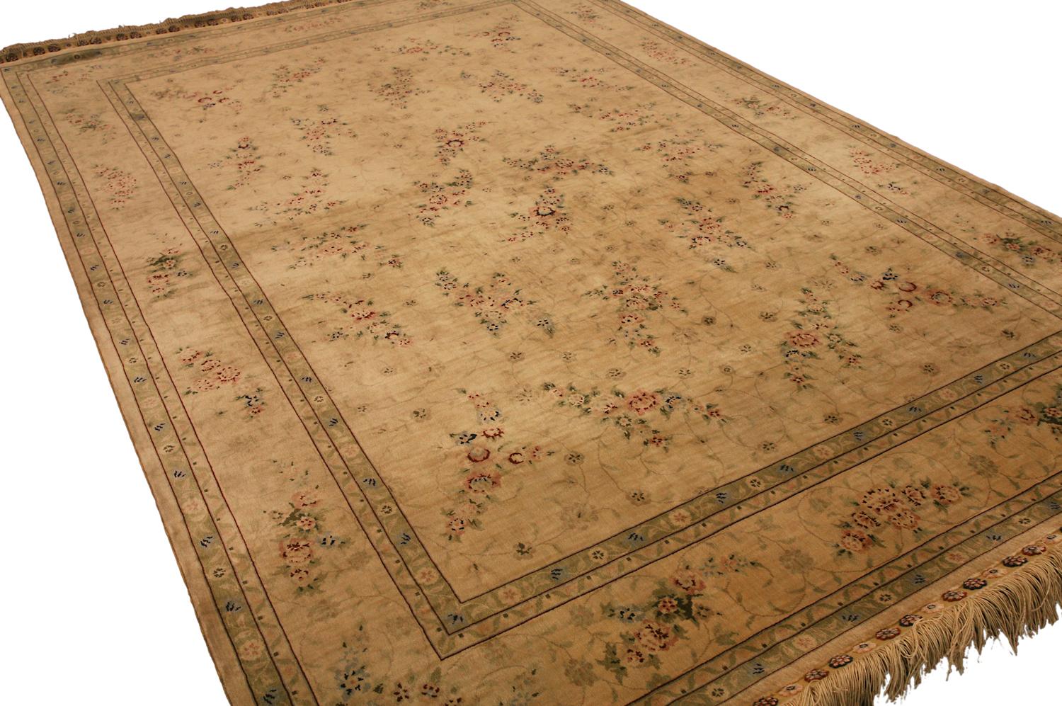 This is a Chinese Hereke silk rug woven during the 21st century that contains a signature that says “Yasamin” and measures 187 x 125 CM in size. This piece has an all-over field design with repeating floral motifs with blossoming flowers