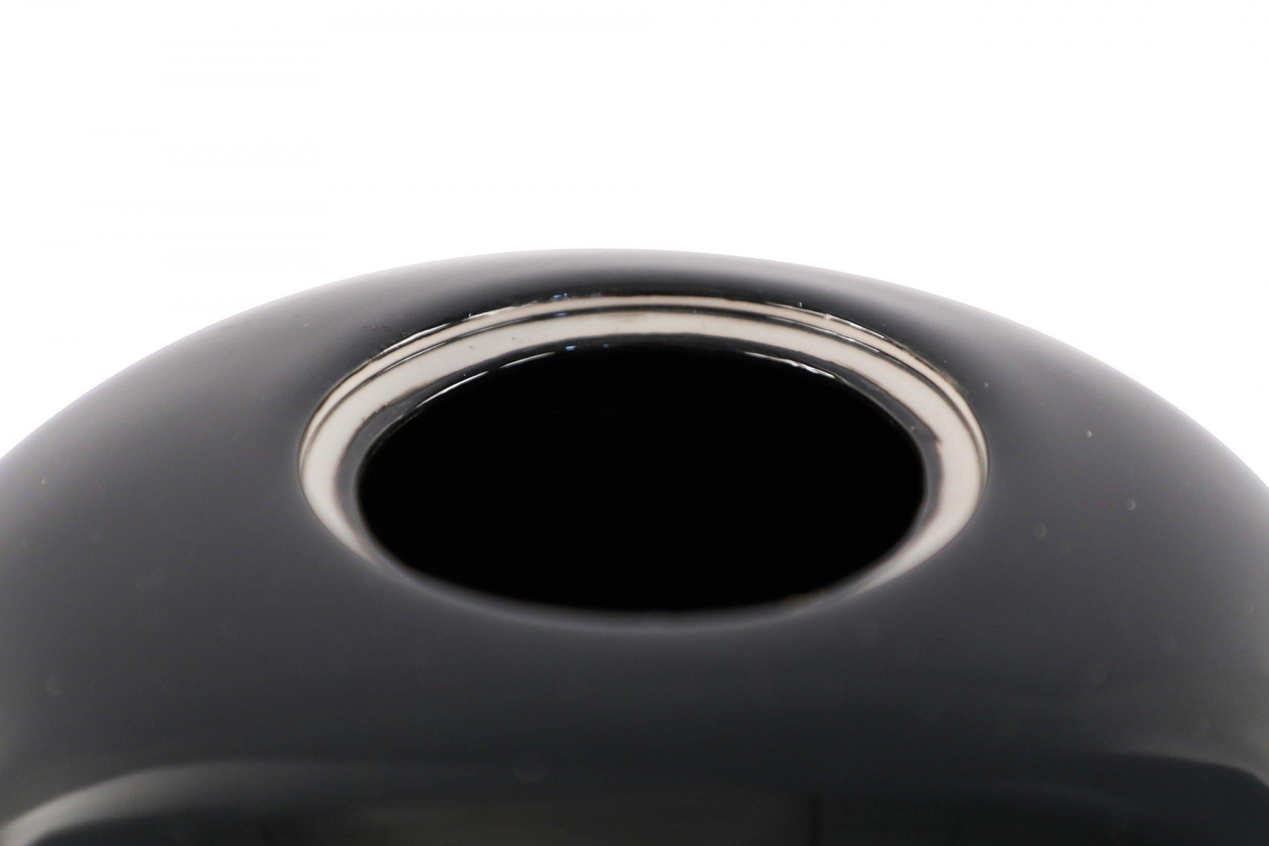 4 Chinese black porcelain vases with high-gloss finishes and finial-topped lids (priced each).
       