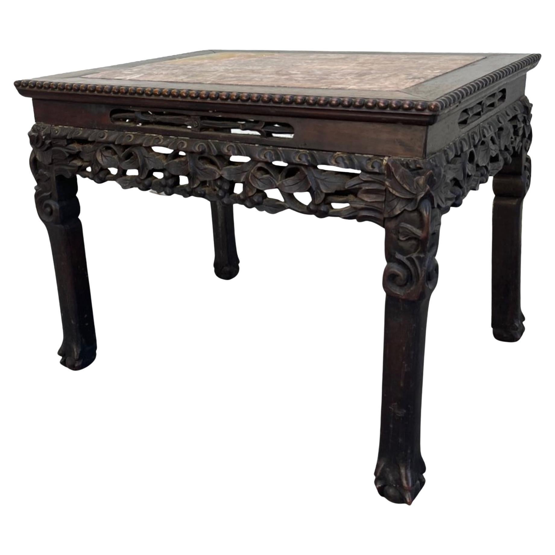 Chinese Hongmu Carved Side Table Qing Dynasty 19th century.

Rare 19th century hand carved Chinese Qing Dynasty Hongmu hardwood side table. The top of the table has a wonderful rouge marble insert. It is surrounded within a raised beaded border.