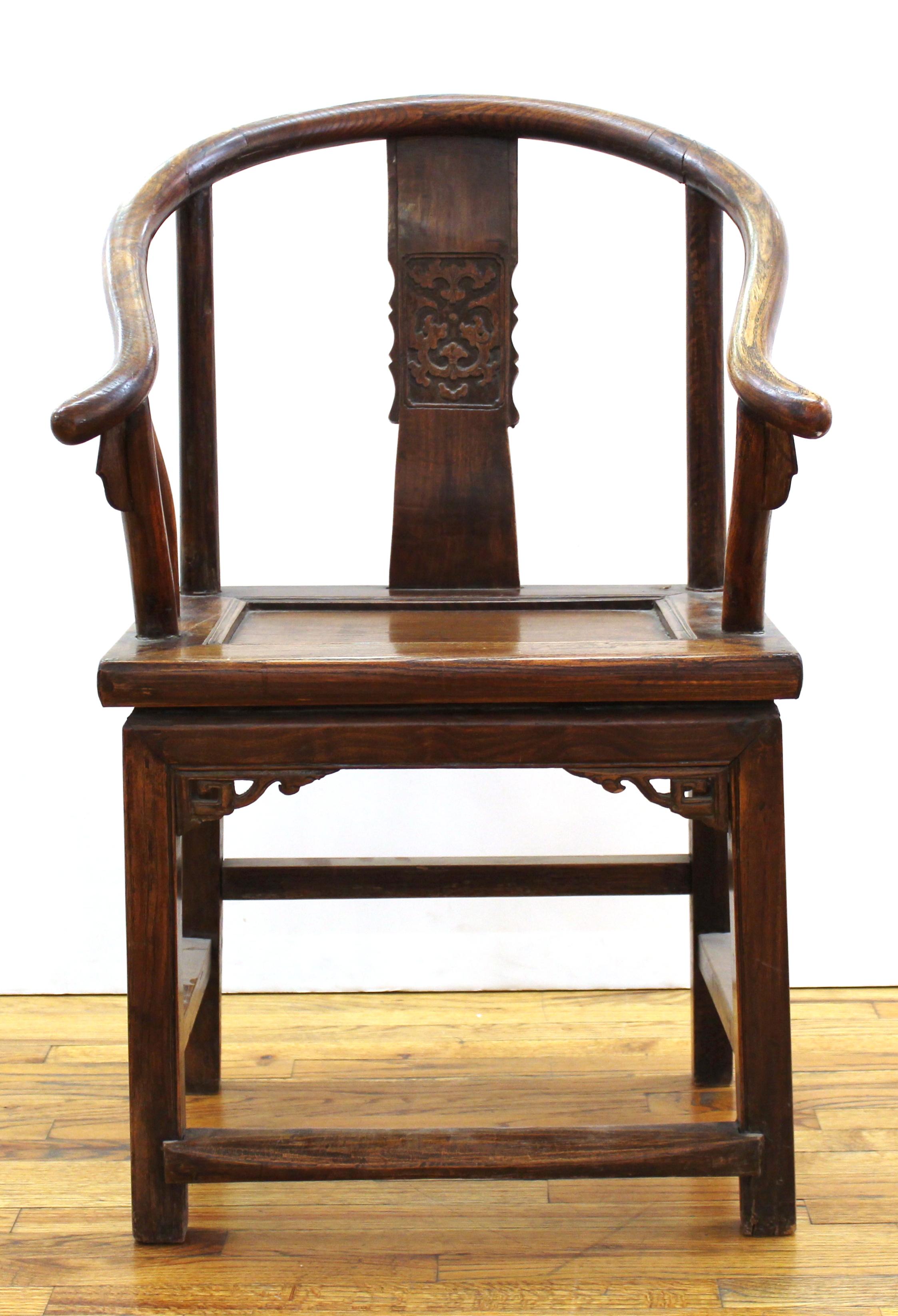 Chinese antique horseshoe back armchair in carved wood. Jian Ding export seal on back of seat.