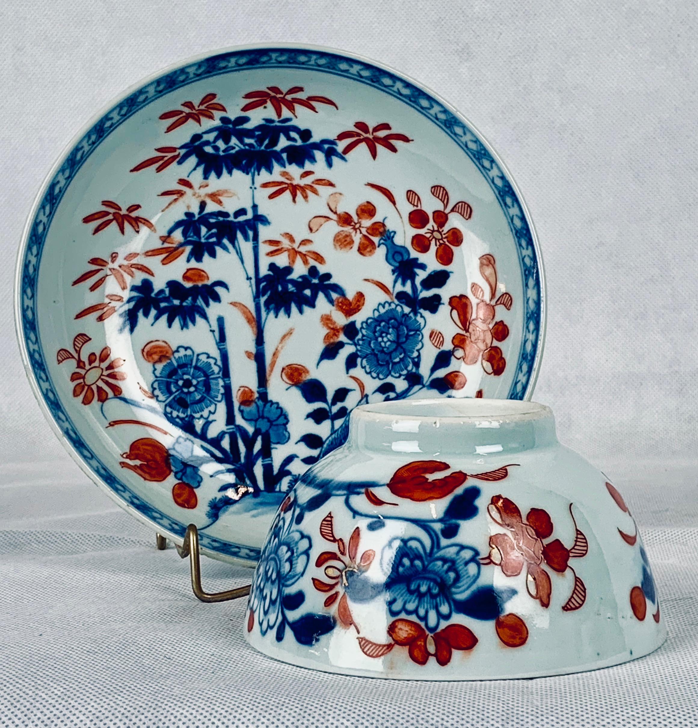 The porcelains made in China in the 18th and 19th centuries that were decorated in iron red and cobalt blue became known as Chinese Imari.  This 18th century porcelain tea bowl and saucer hand decorated in underglaze blue and over painted in iron