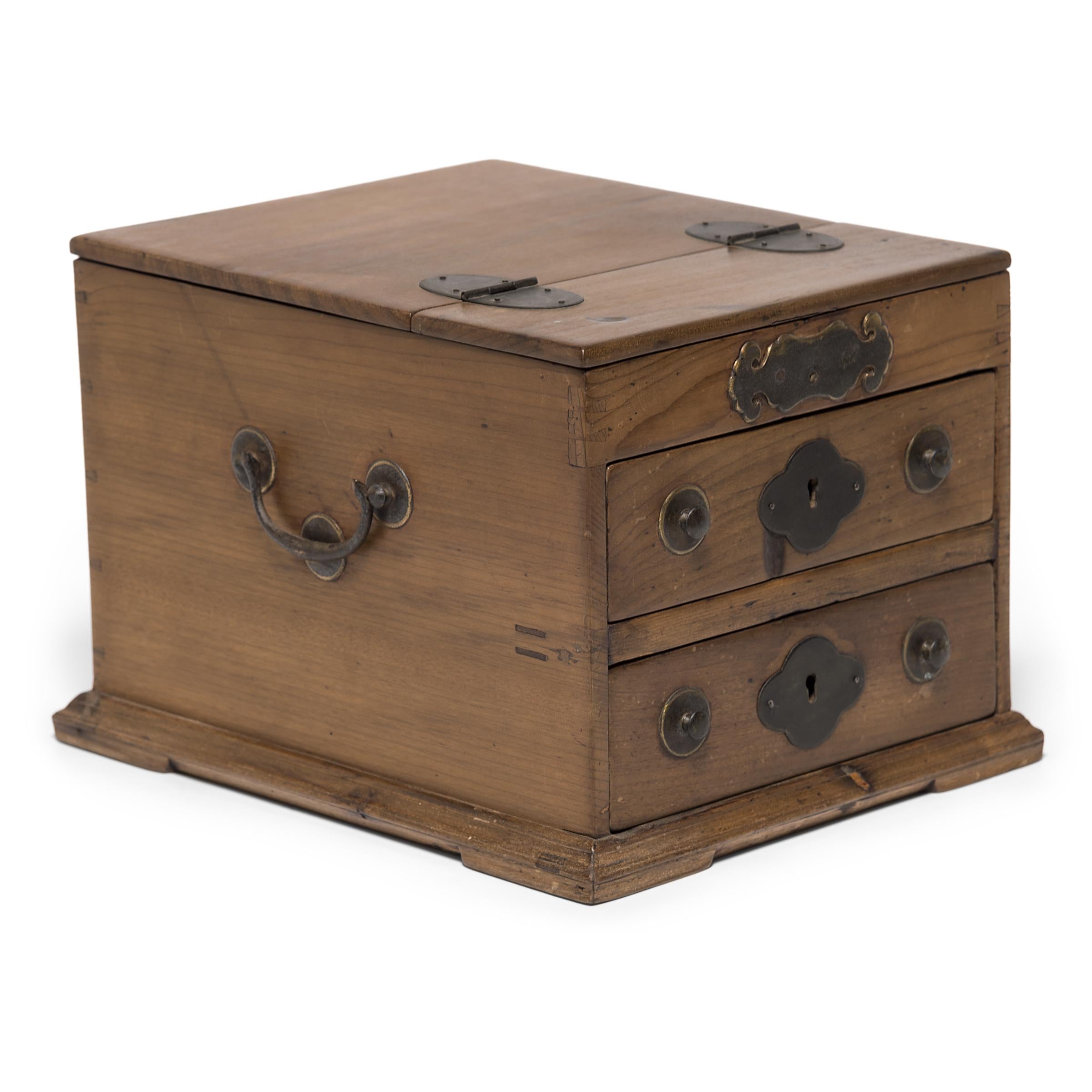 Crafted in the early 20th century in China's Jiangsu province, this jewelry chest was once used by a Qing-dynasty woman to contain her personal treasures. A lock in the shape of two lingzhi fungi tops the jewelry box, symbols of longevity and