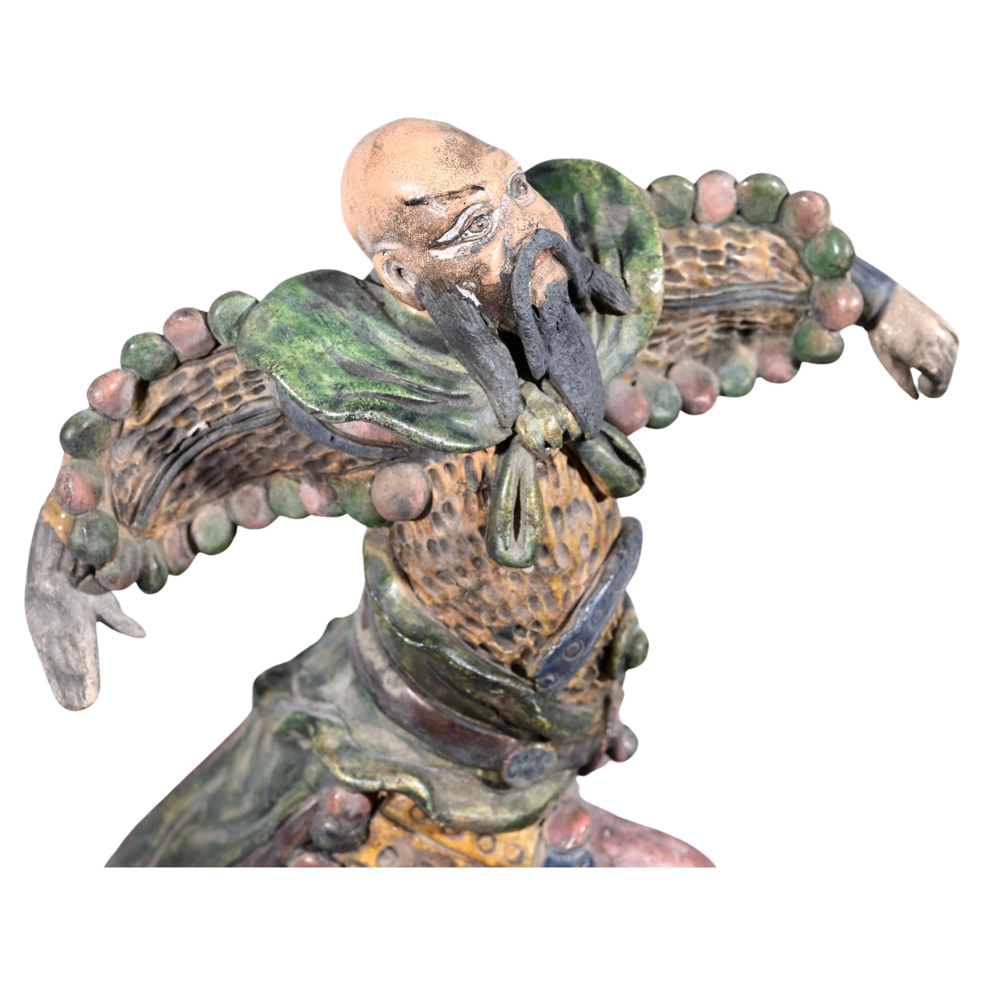 Chinese polychrome enameled ceramic roof ornament, early 20th century, These figurines were designed to ward off evil spirits and protect the owners. It is a versatile type of Chinese decoration using glazes, predominately in three colors-amber,