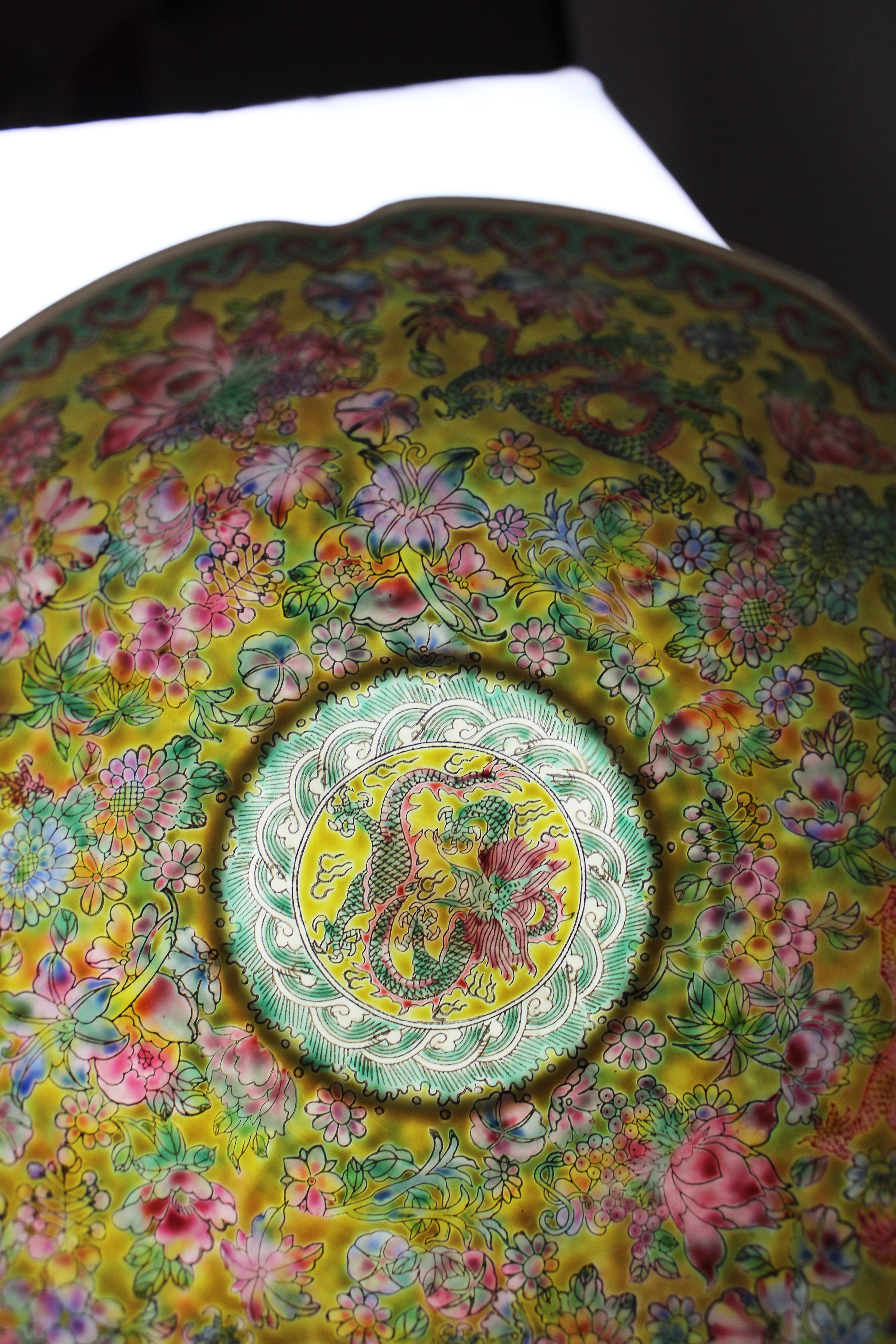 Presenting an exquisite piece of Chinese craftsmanship: the Imperial Yellow Bowl, crafted from delicate eggshell porcelain in the 20th century. Adorned with intricate depictions of eight five clawed dragons, this bowl exudes regal elegance and