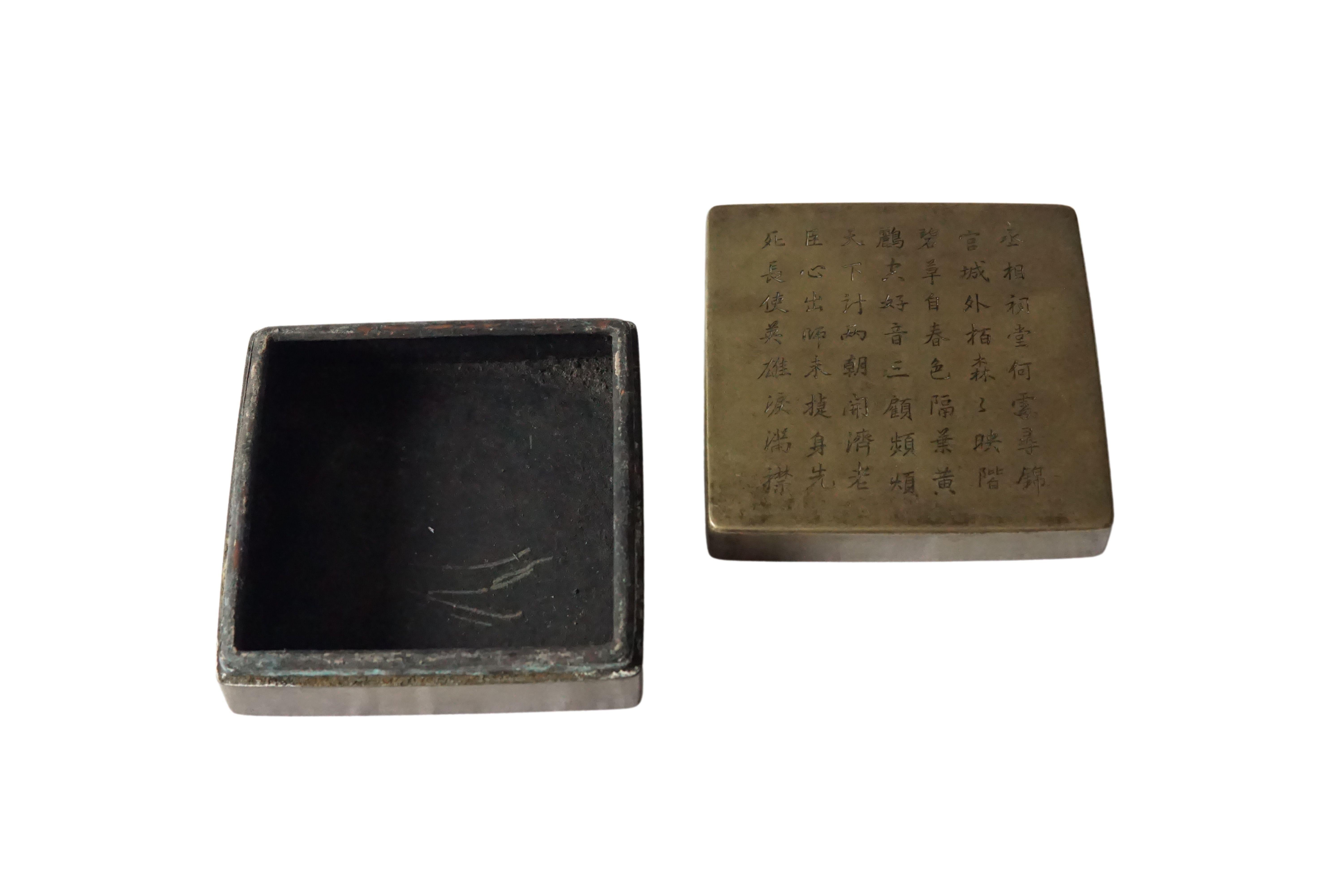 small bronze box with engravings