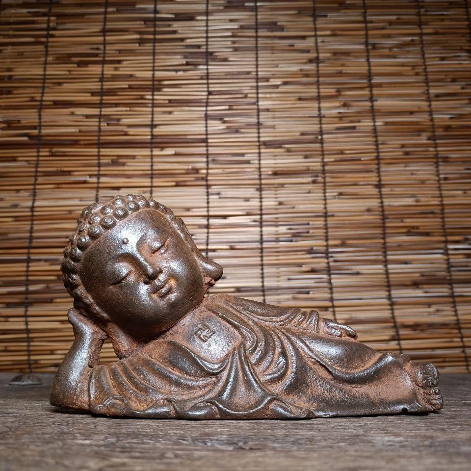 This Chinese iron statue of the Sleeping Sakyamuni Buddha with a big head is a distinctive and spiritually significant piece that embodies deep cultural and religious symbolism.

Sakyamuni Buddha, also known as Siddhartha Gautama, is the historical