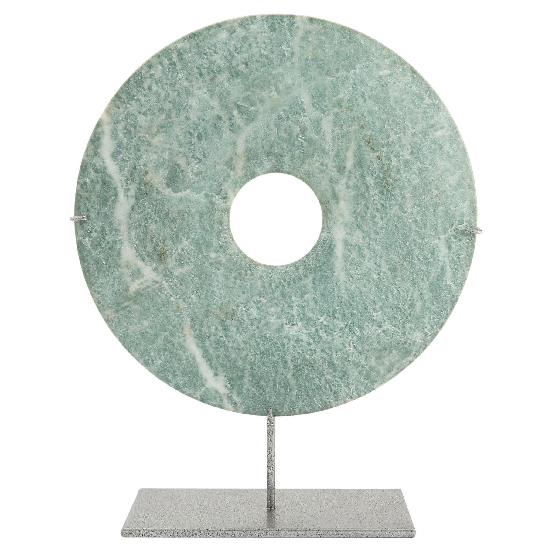 Which dynasty is known for bi discs of jade?