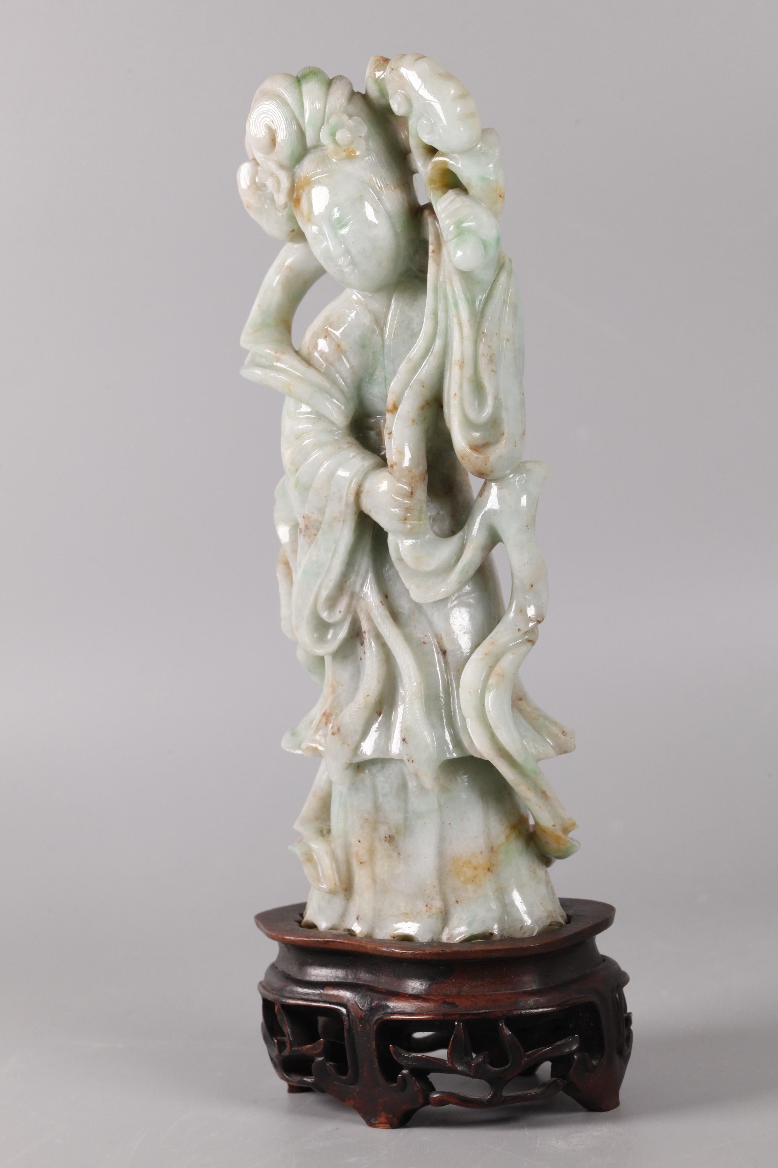 on fitted wooden base; 1in(D) x 3in(W) x 8in(H) are the dimensions of the jade carving only; overall measurements with wooden base: 9.5in(H) x 3.5in(W) 