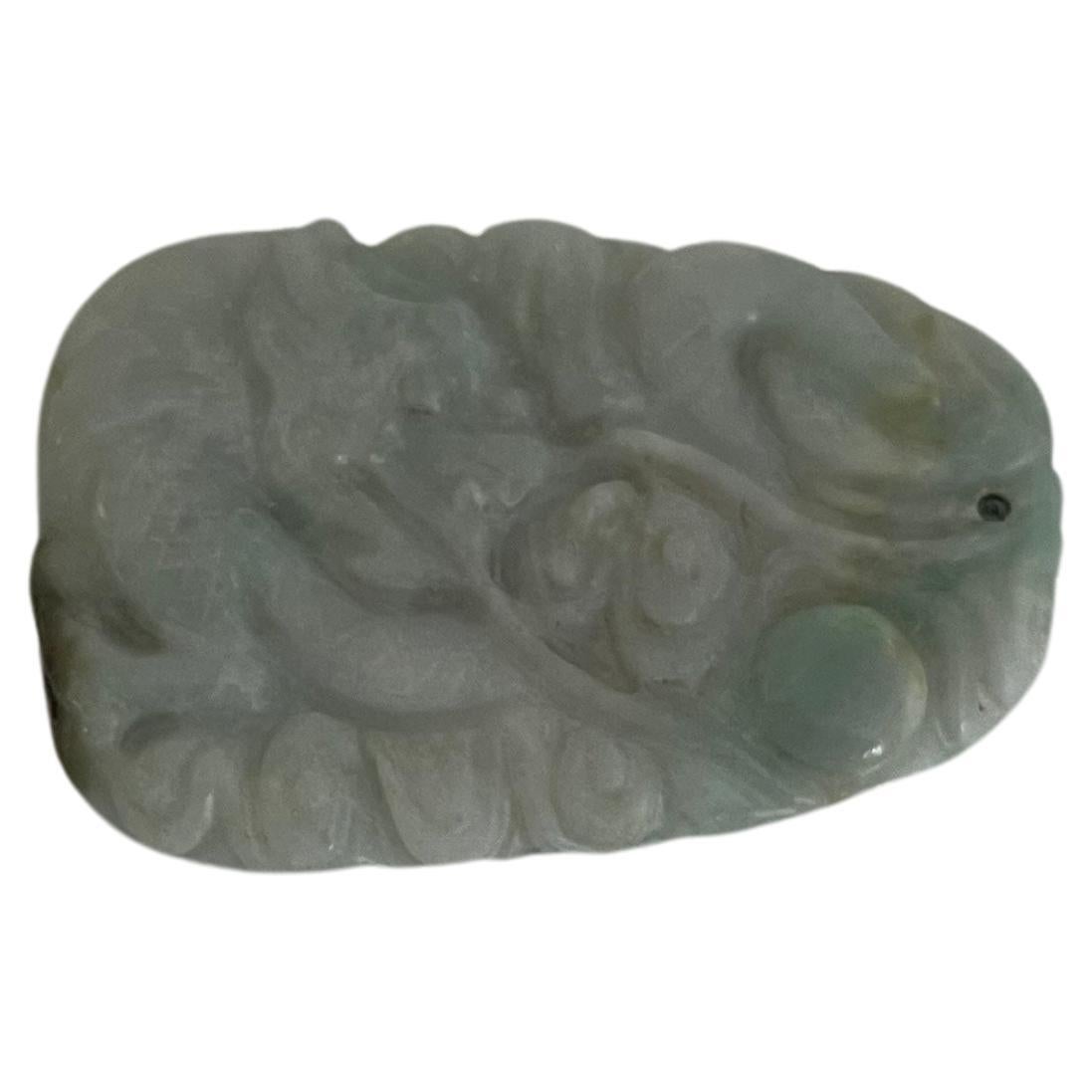 This is a very good Chinese Jade,  Jadeite / Nephrite stone pendant that we date to the early 19th Century, Qing period.

The jade has various colours within the stone, mainly a very pale dove grey with a soft light turquoise blue-green (more