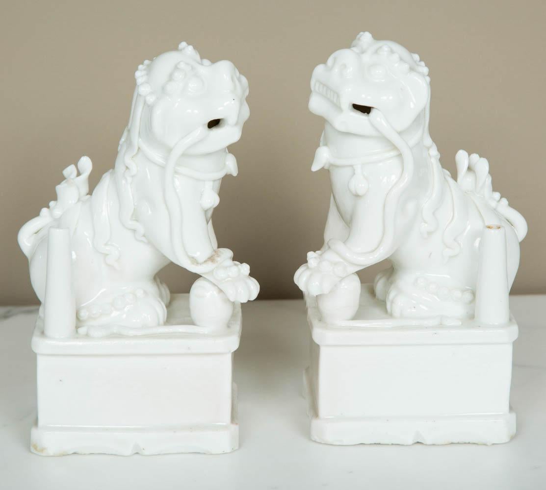 Well modelled pair of Chinese Blanc de Chine Foo dogs dating around 1680 and richly ornate.
Overall in good condition, no restoration: one has a small chip in the inner side of the base, a small chip at the top of the joss stick holder and tiny