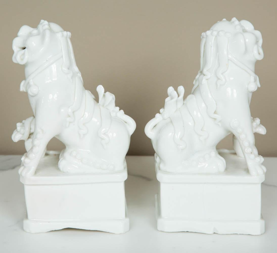 Glazed Chinese Kangxi Pair of Blanc de Chine Buddisth Lions or Foo Dogs, 17th Century