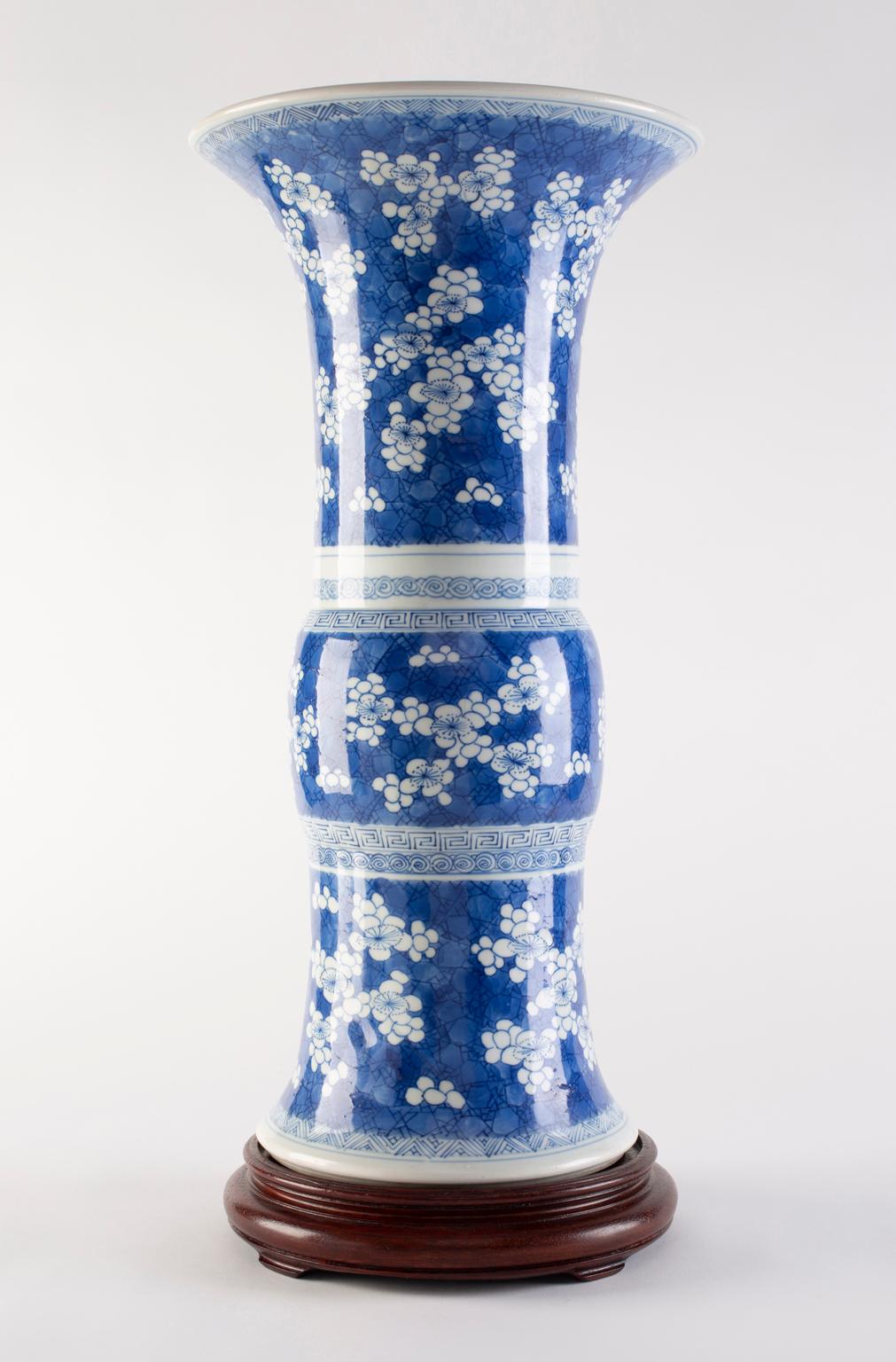 Provenance: a Park Avenue collection

Chinese Kangxi Period blue and white glazed porcelain vase, Gu decorated with blossoming white prunus on a 'cracked ice' ground.