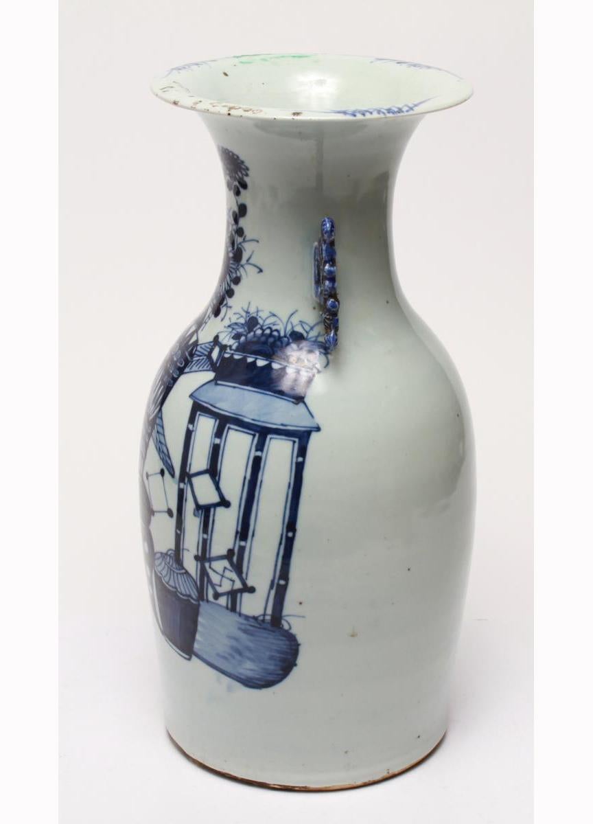 Chinese Kangxi Revival porcelain vase in cobalt blue and white underglaze, depicting auspicious symbols. The piece has reticulated handles of blue flowers and foliage. Some glaze imperfections and losses and old repairs to lip of rim. Some rust