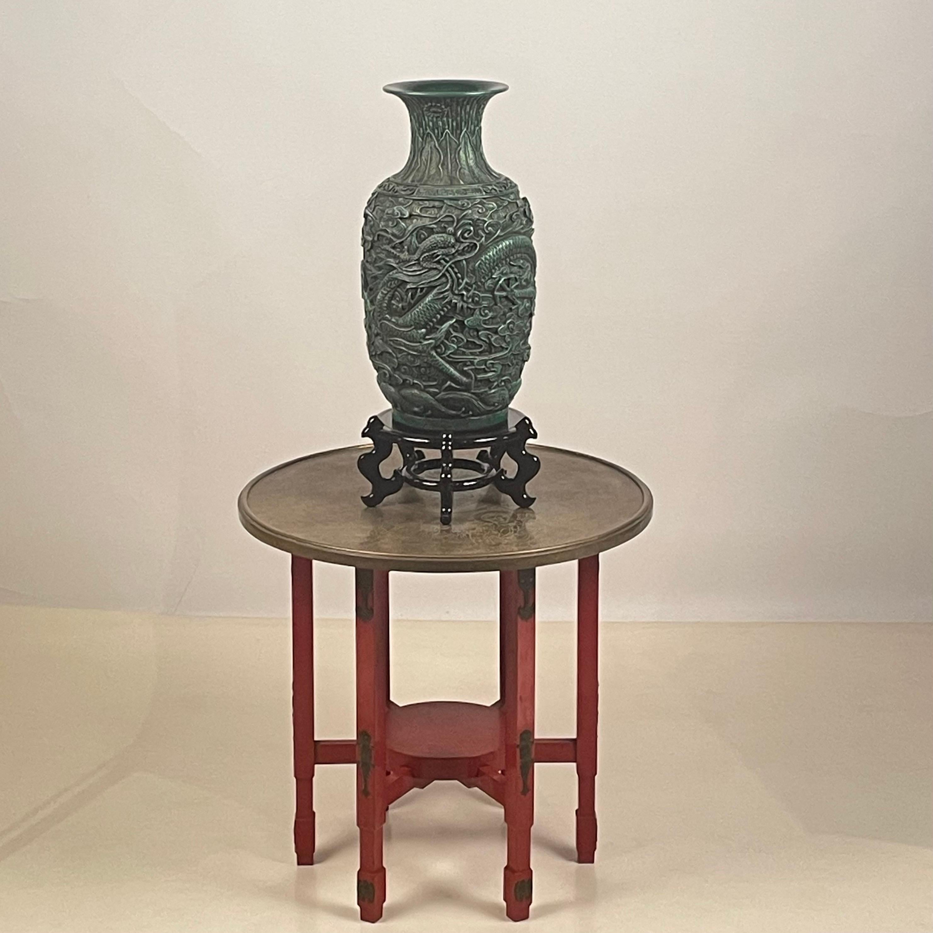 Chinese lacquer and bronze table with green dragon vase the style of Tony Duquette.

Dimensions listed are the overall dimensions of the table plus the vase, as on the main picture.
Table is 23 in. diameter x 22 in. tall.
Vase and stand together