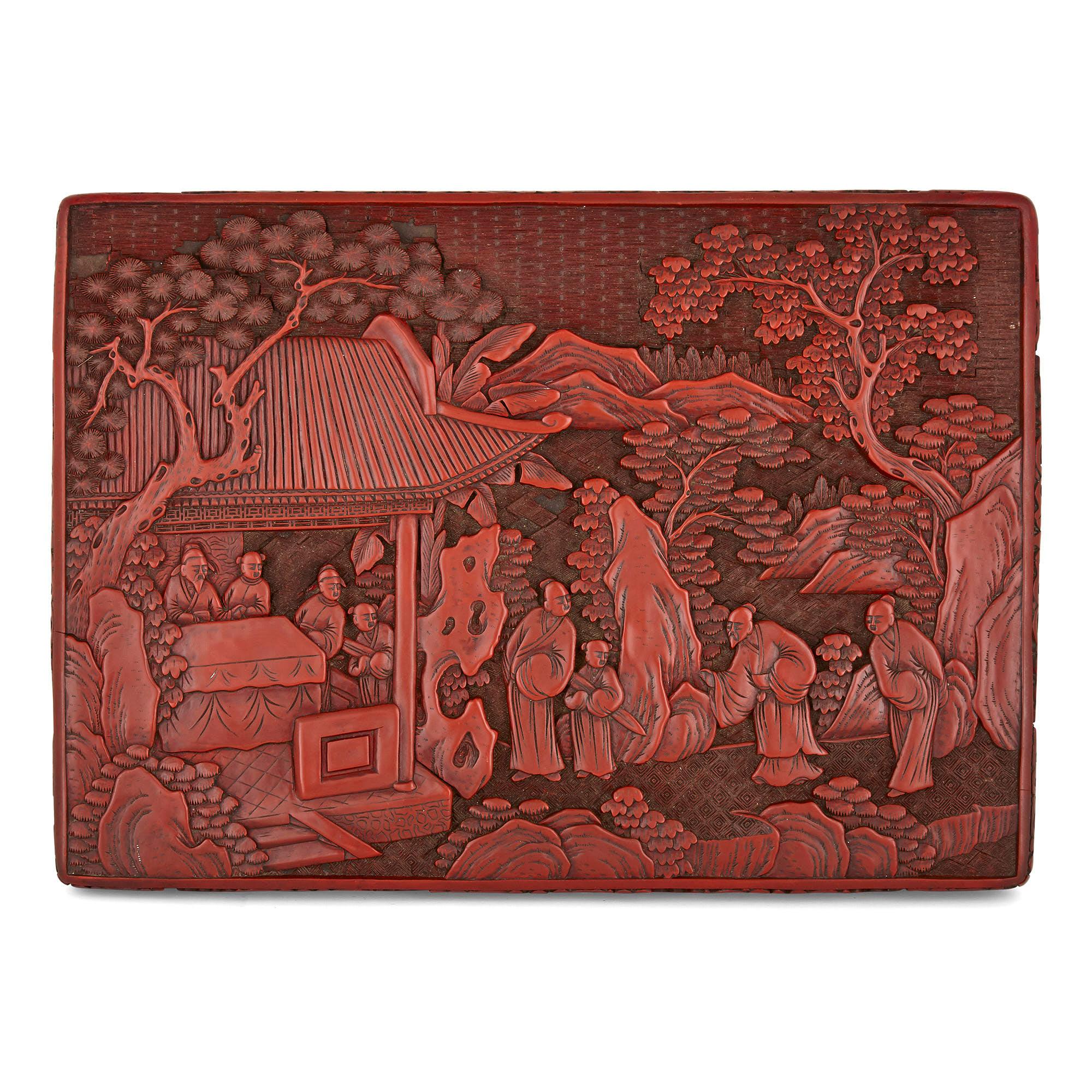Antique Chinese Lacquer Gaming Box and Counters
Chinese, late 19th century
Height 9.5cm, width 32cm, depth 23cm

This beautiful Chinese red lacquer box, the surfaces carved with traditional Chinese scenes in fine relief, contains three tiers, each