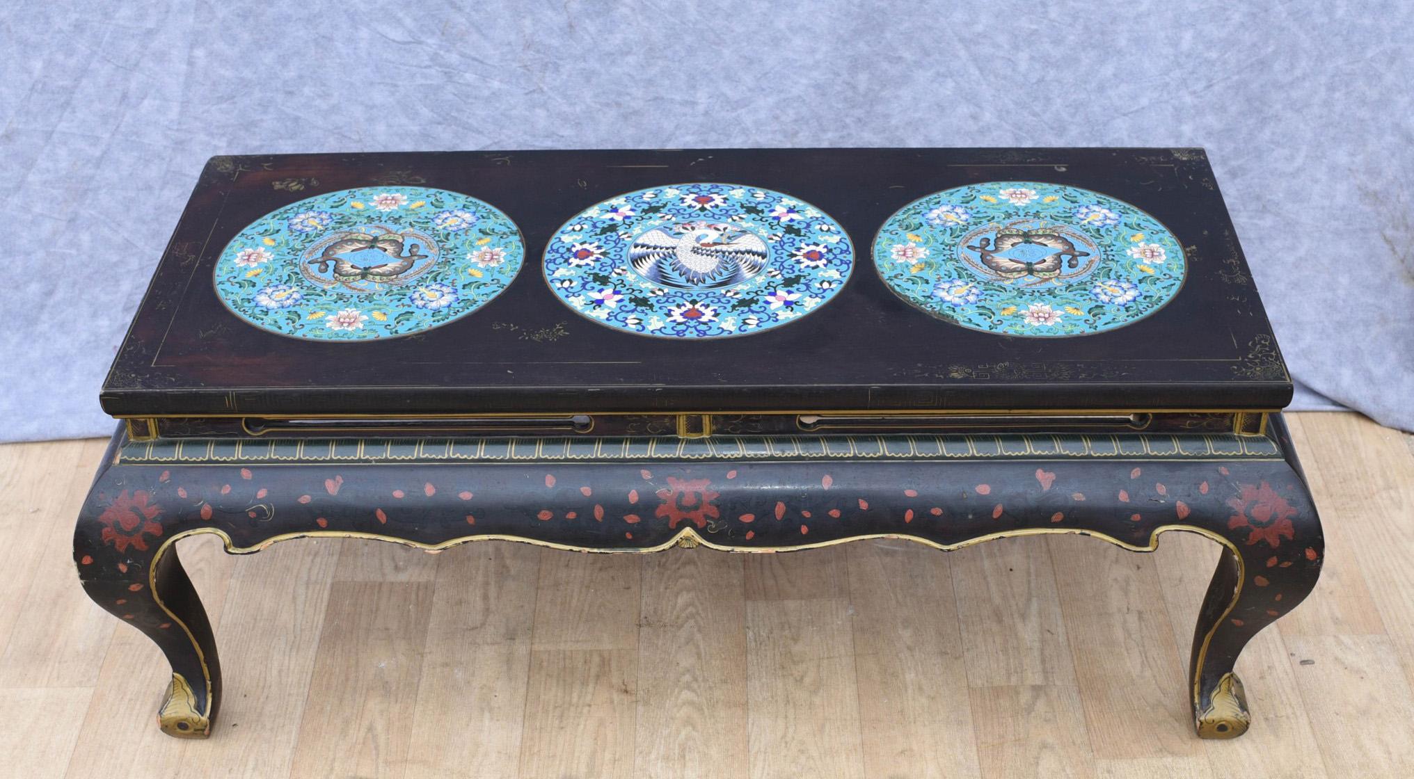 Gorgeous Chinese black lacquer coffee table
Decorated with three Cloisonné porcelain plaques
Great interiors piece.


