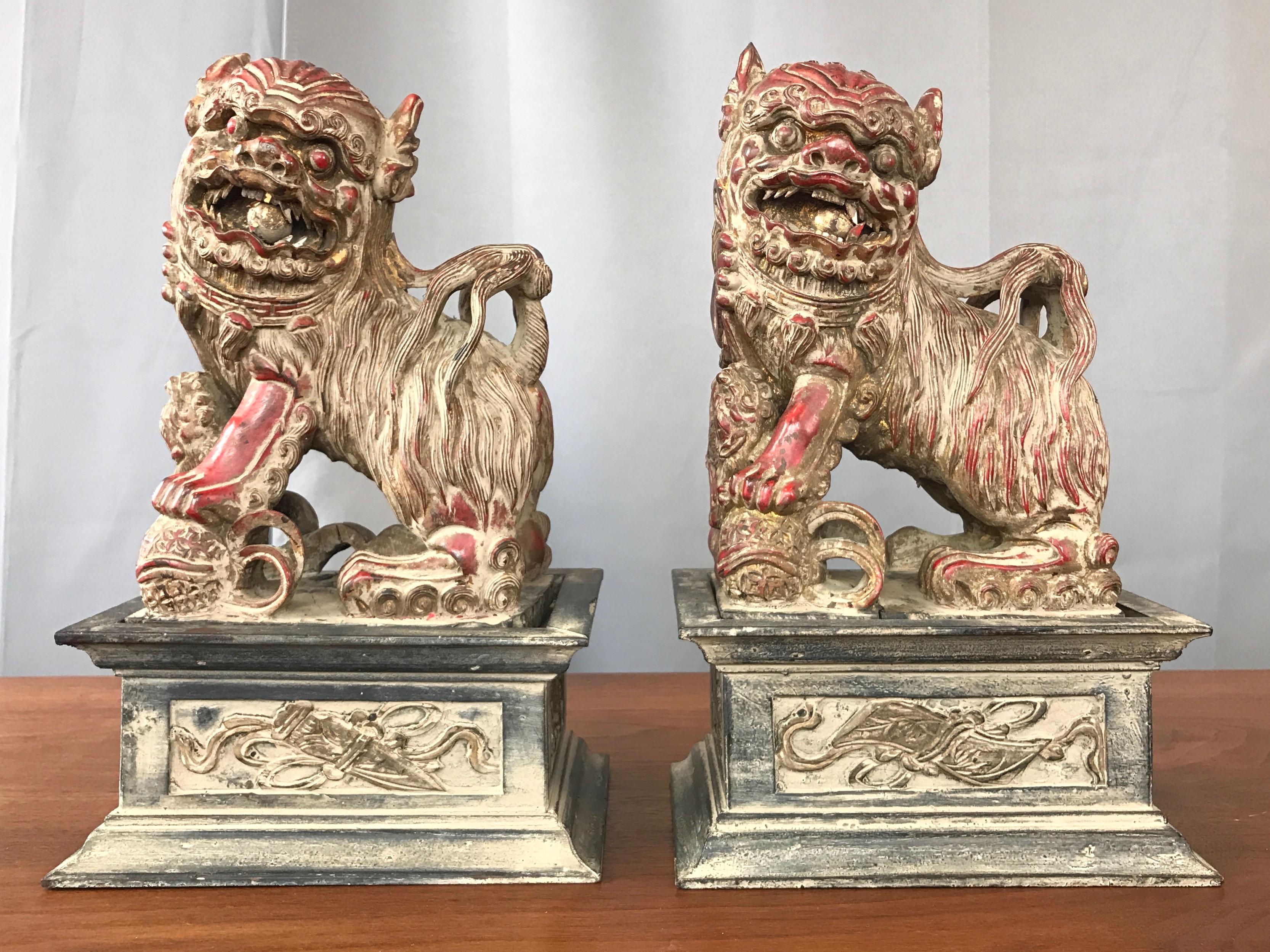 A pair of Chinese post-Qing period lacquered and gilt wood guardian lions—commonly known as “Foo Dogs”—on pedestal bases, circa 1920s–1930s.

Very finely carved sculptural figure displays exquisite detail while exuding fierce personality and