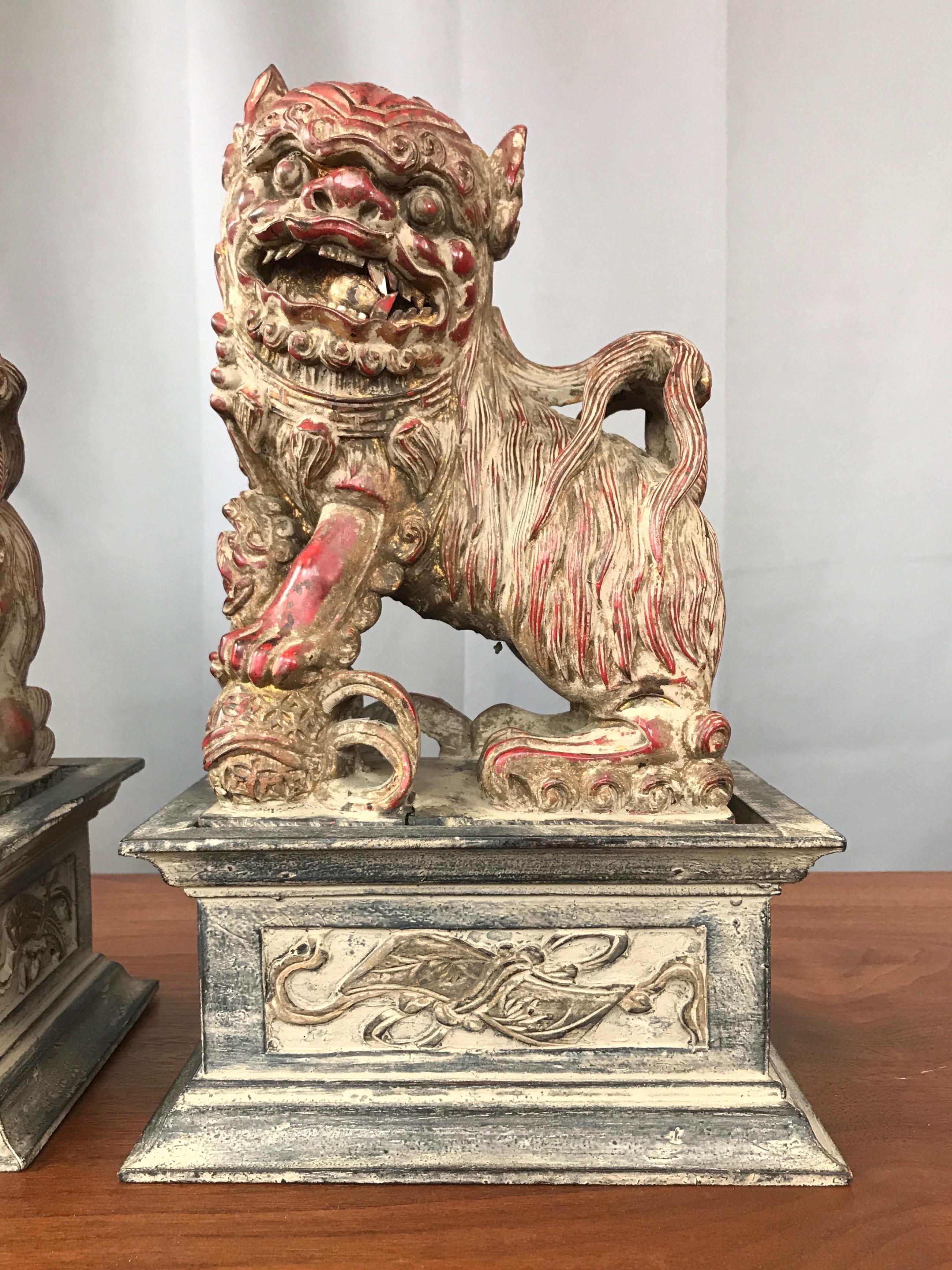 Chinese Lacquered and Giltwood Guardian Lions on Pedestals, a Pair In Good Condition In San Francisco, CA