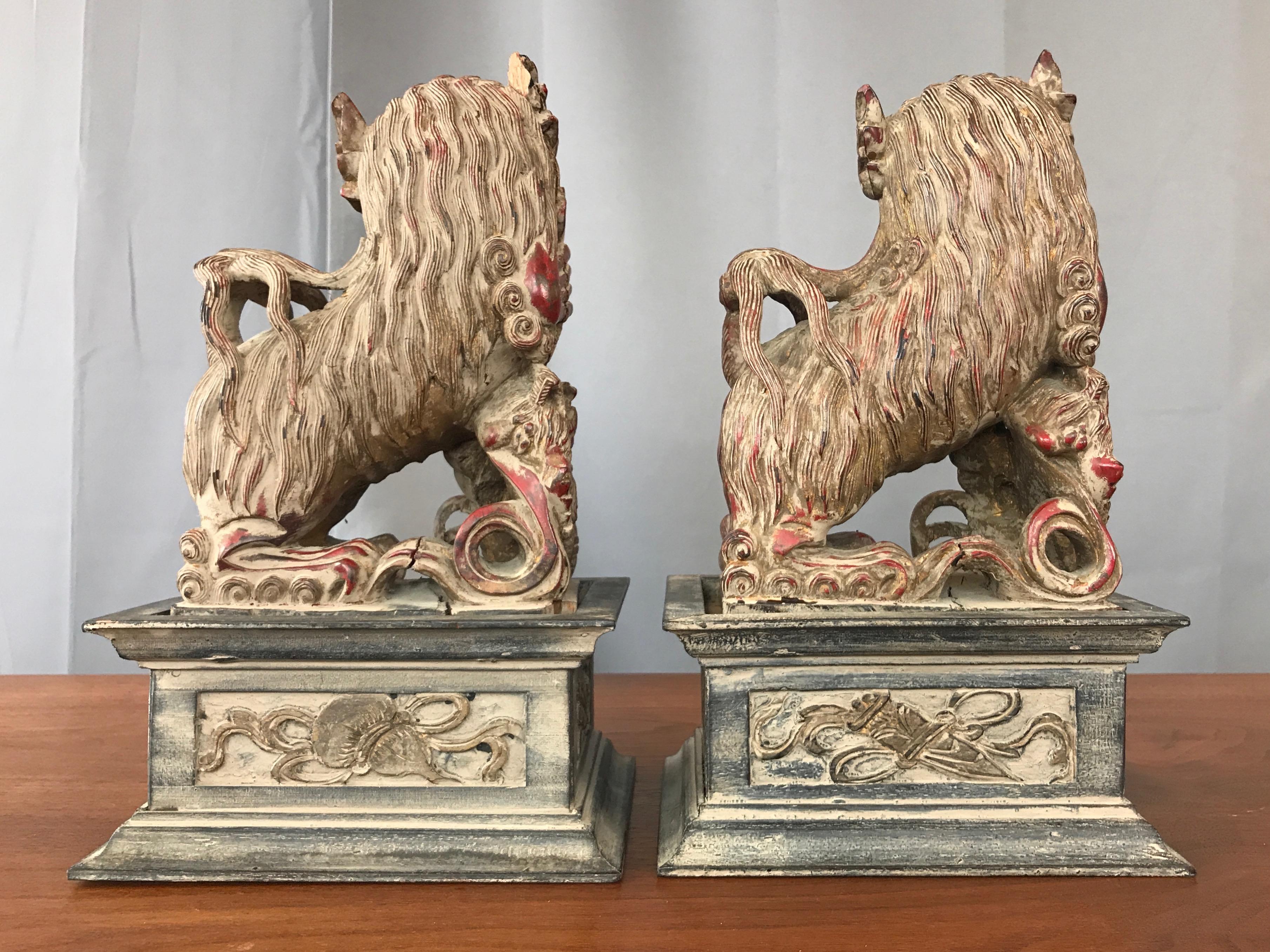 Wood Chinese Lacquered and Giltwood Guardian Lions on Pedestals, a Pair